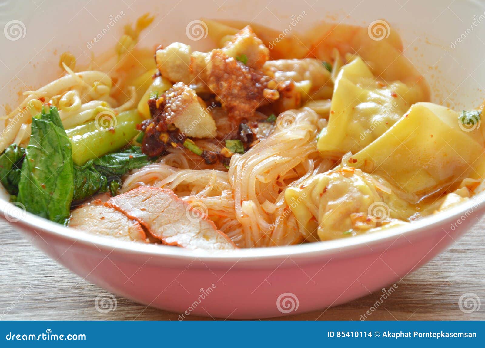 Thin Rice Noodle Topping Dumpling and Slice Barbecue Pork in Soup Stock