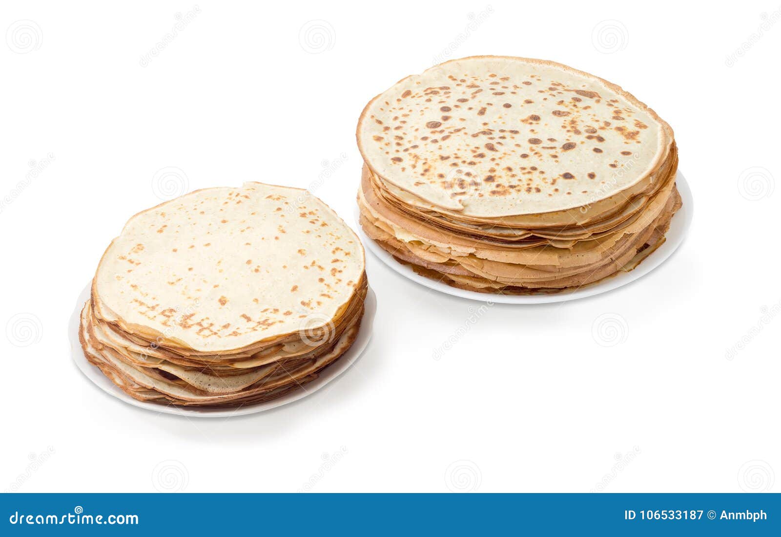 Thin Round Pancakes Two Different Sizes on White Dishes Stock Image
