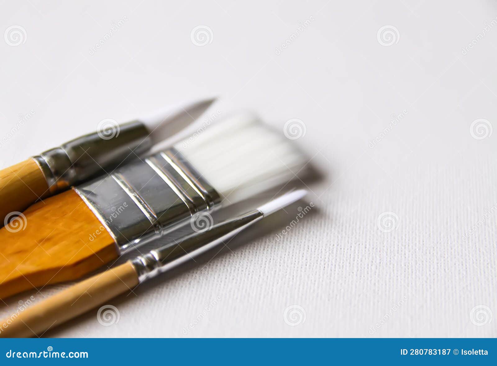 Thin and Thick Synthetic Painting Brushes on White Background Stock