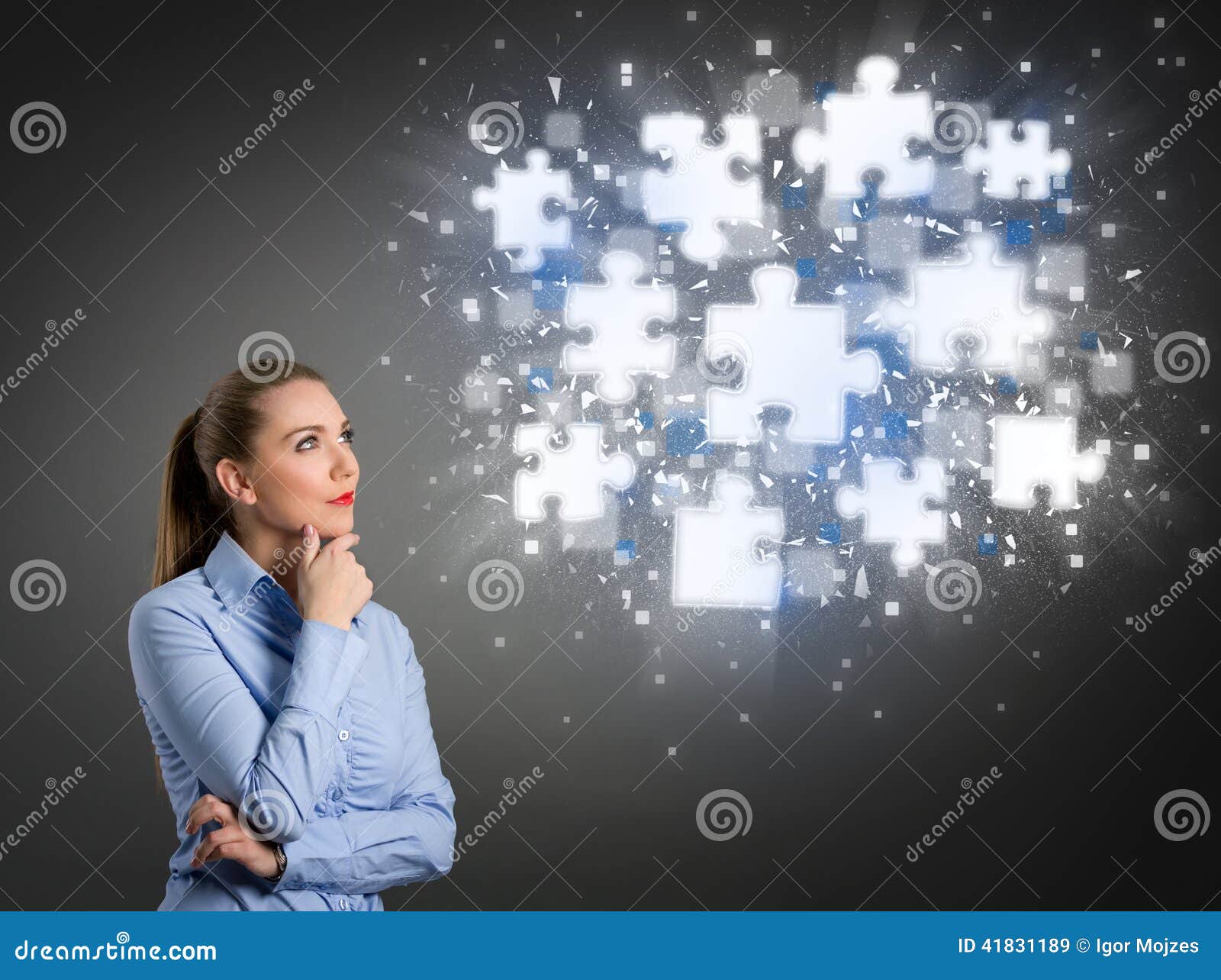 thinking businesswoman looking at shining puzzle pieces