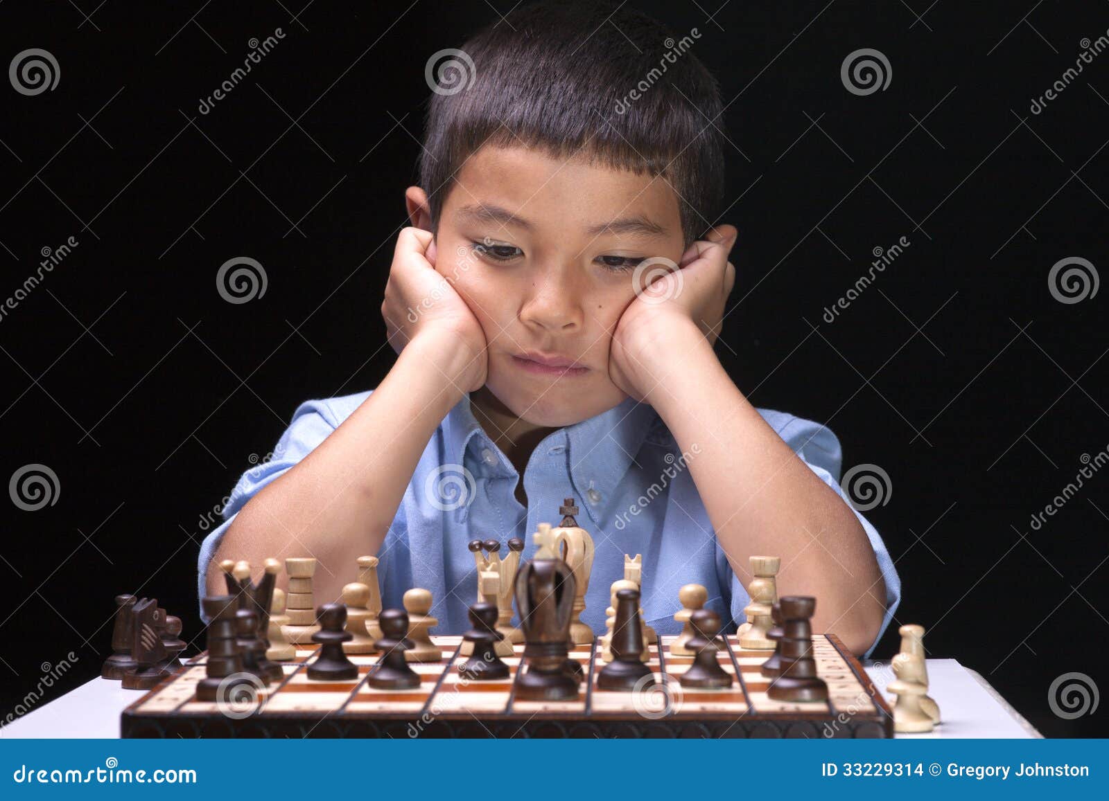 Children's Restraining Hand Thoughtfully Figure Before The Next Chess Move  Stock Photo, Picture and Royalty Free Image. Image 77247675.