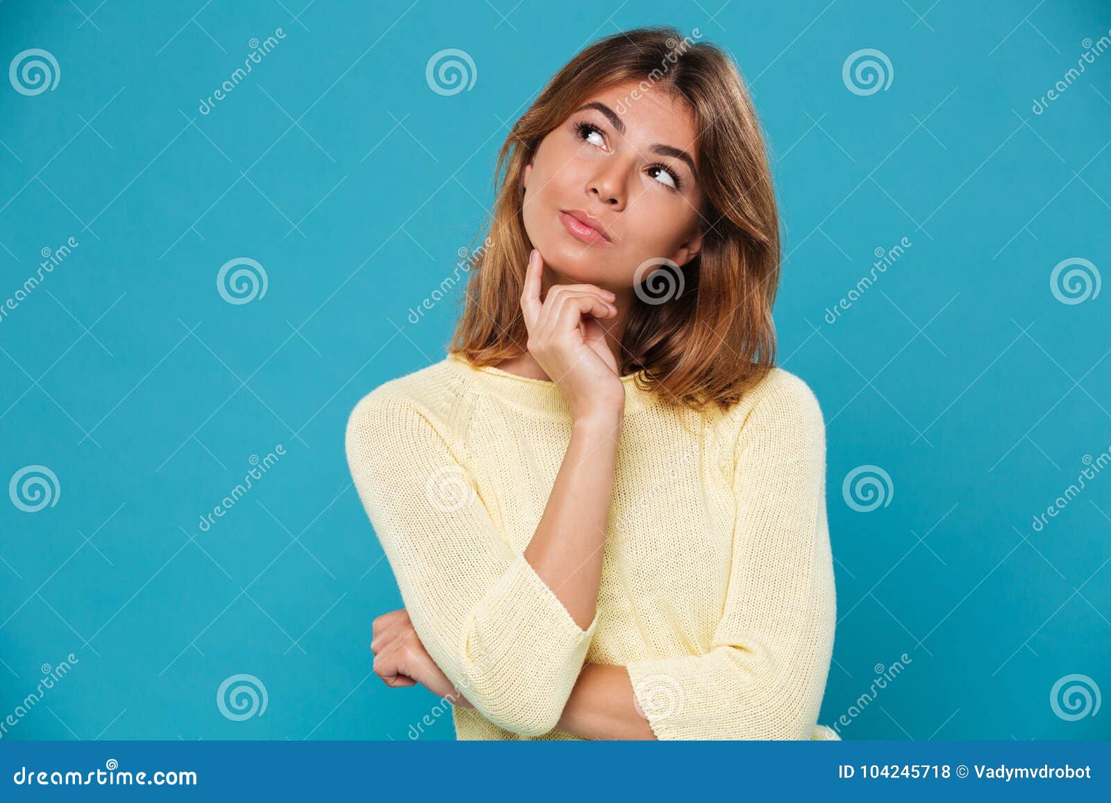 thinking pretty woman over blue background