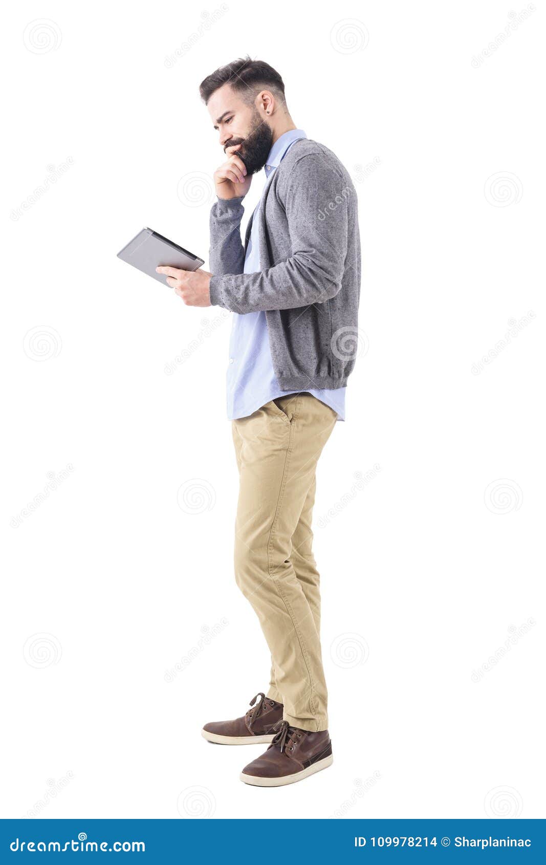 Thinking Young Business Man Looking At Tablet With Hand On Chin Stock ...