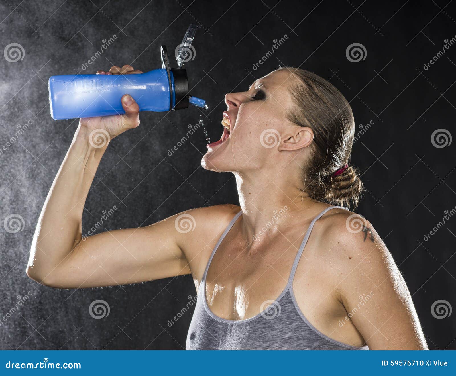 Woman Squirting Water Bottle Stock Photos - Free & Royalty-Free Stock  Photos from Dreamstime
