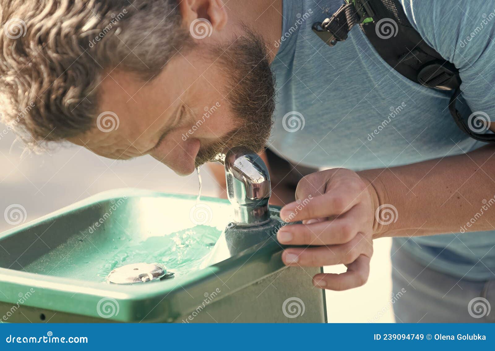 Thirsty Guy Drink Water from Drinking Fountain Quenching Thirst