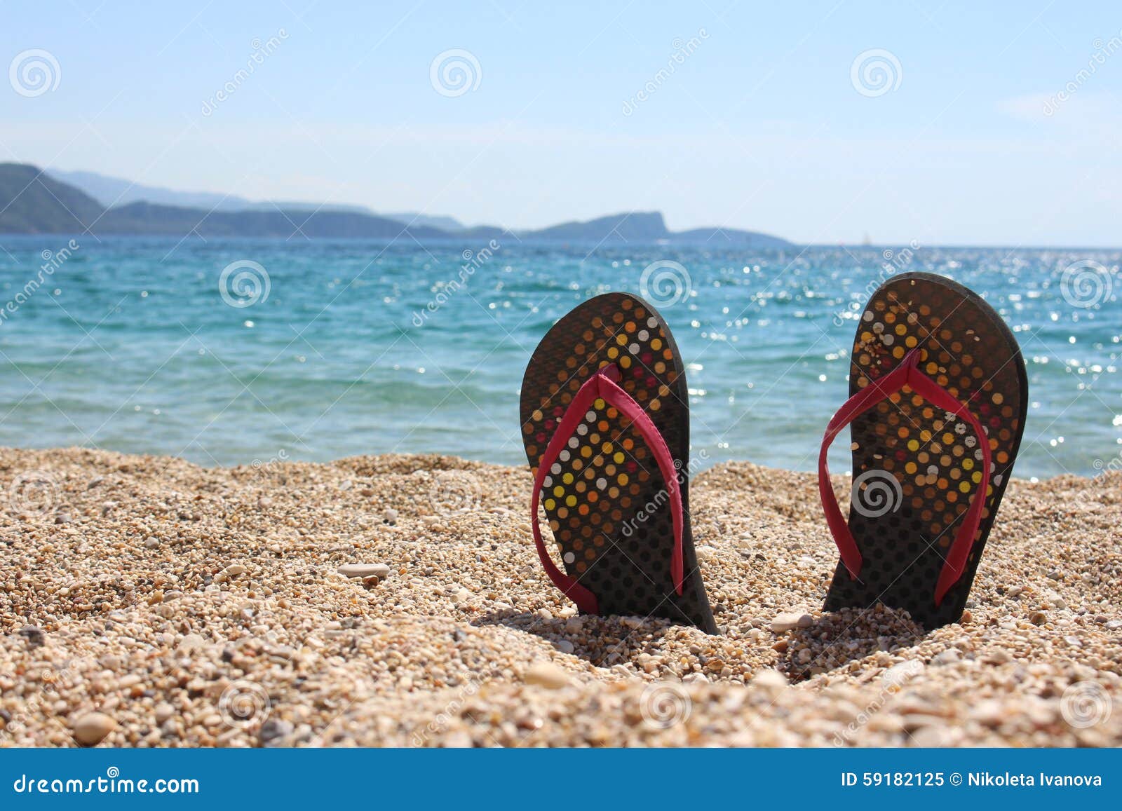 Thongs on the beach stock image. Image of rock, sunny - 59182125