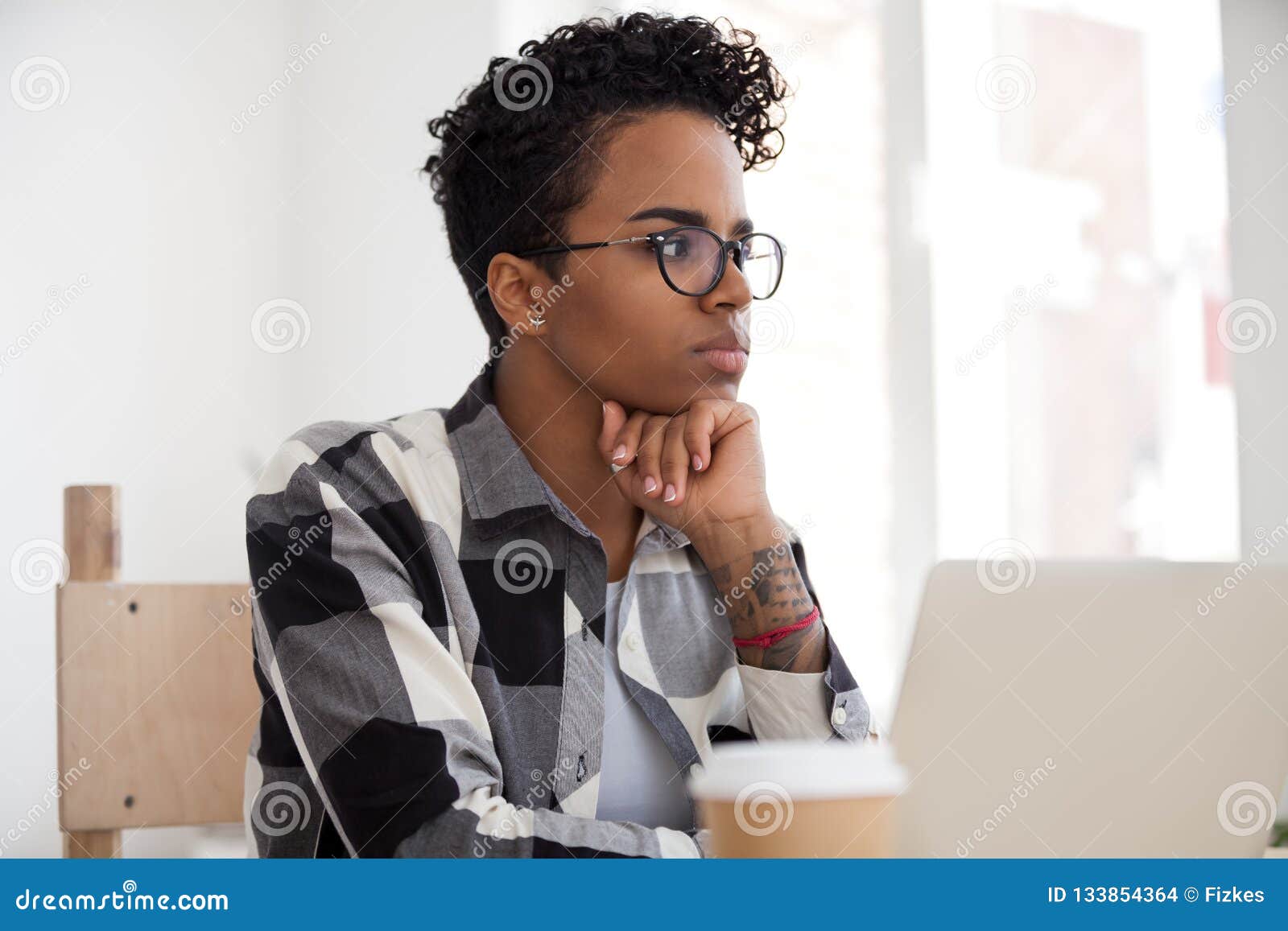 thoughtful black female look in distance making decision