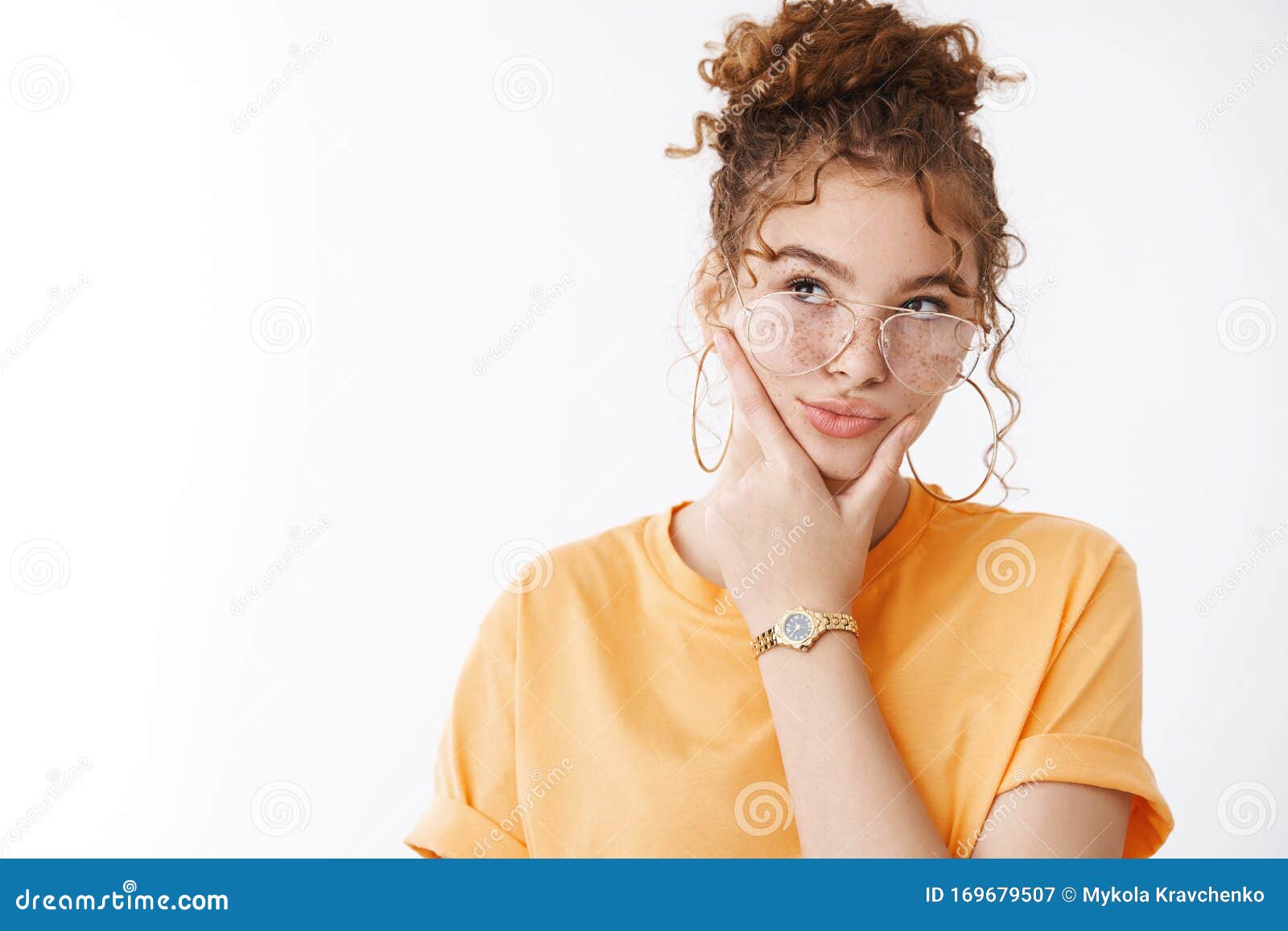 thoughtful creative attractive redhead curly-haired female blogger thinking make-up new content ideas look focused take