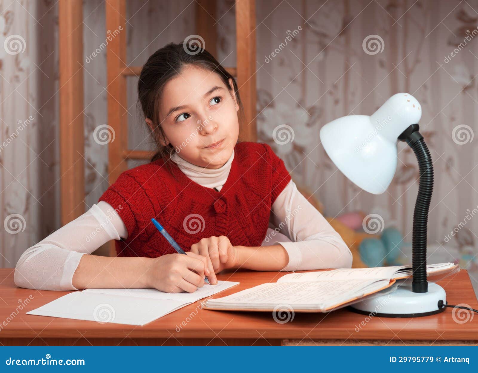 Little Girl Doing Homework. Homework From School. Stock 