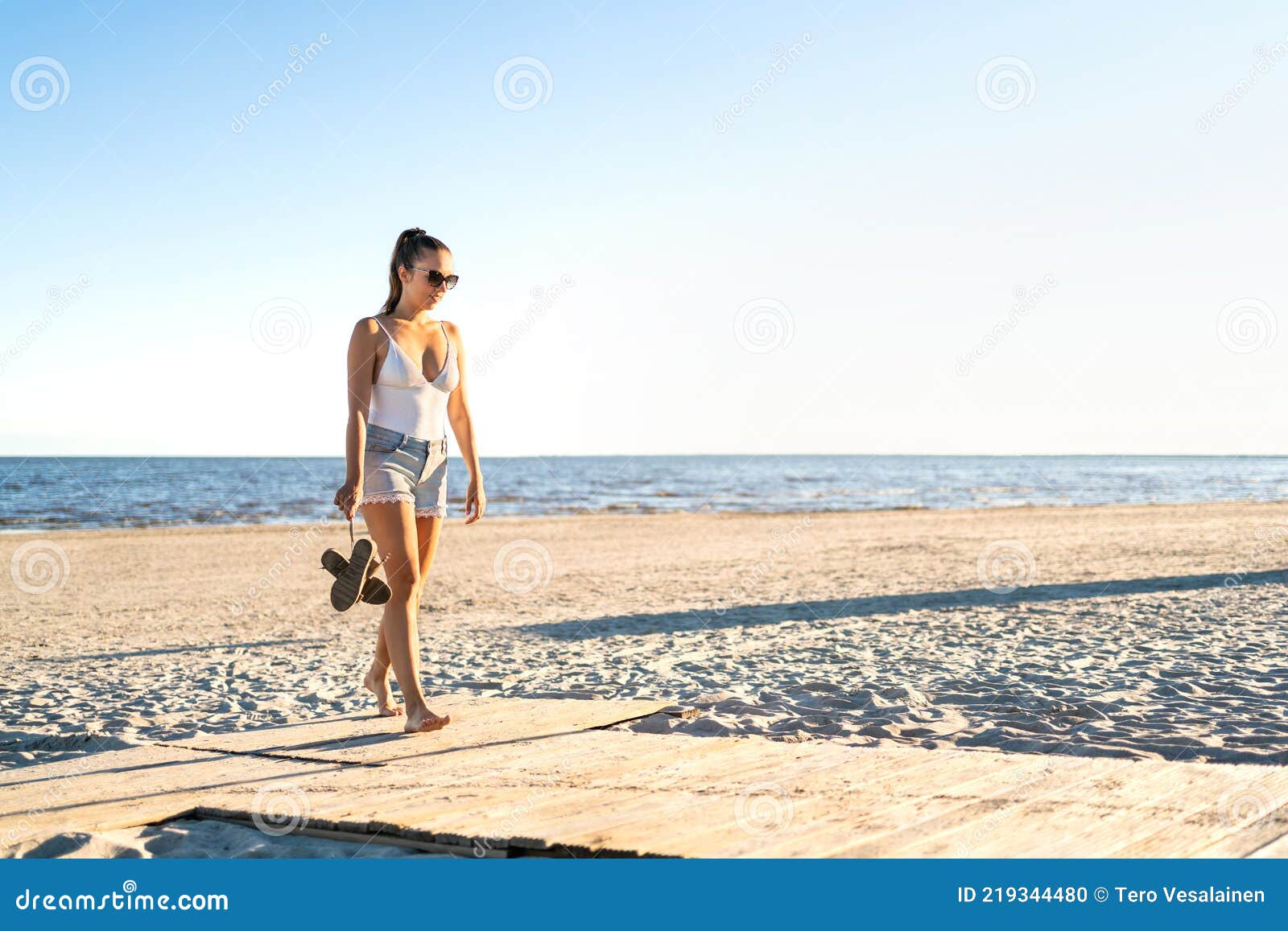 Thoughtful Lonely Woman Walking at an Empty Beach. Thinking about ...