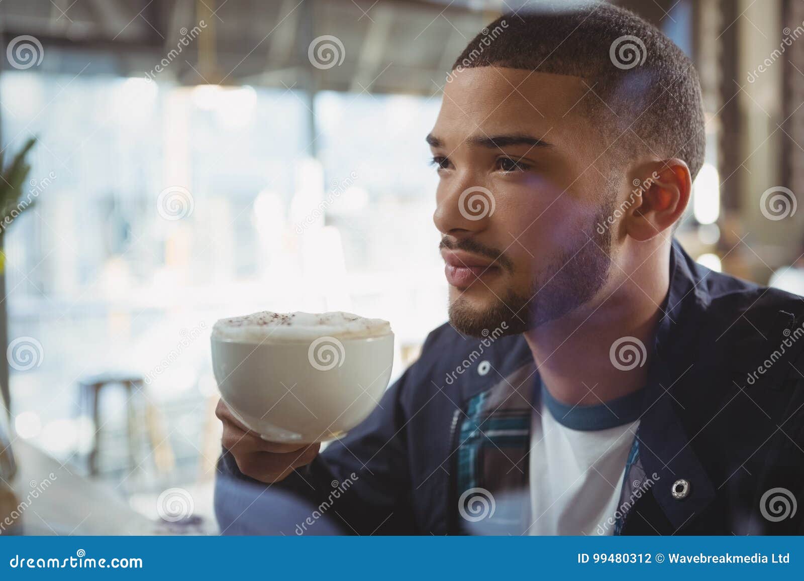Thoughtful Man Having Coffee In Cafe Stock Photo - Image of holding ...
