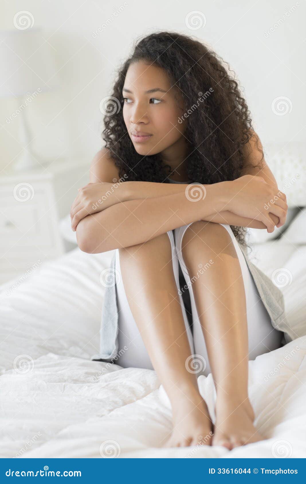 Thoughtful Teenage Girl Sitting on Bed Stock Photo - Image of ...