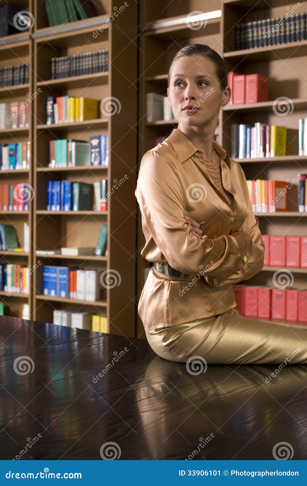 Thoughtful Woman Sitting On Library Desk Stock Image