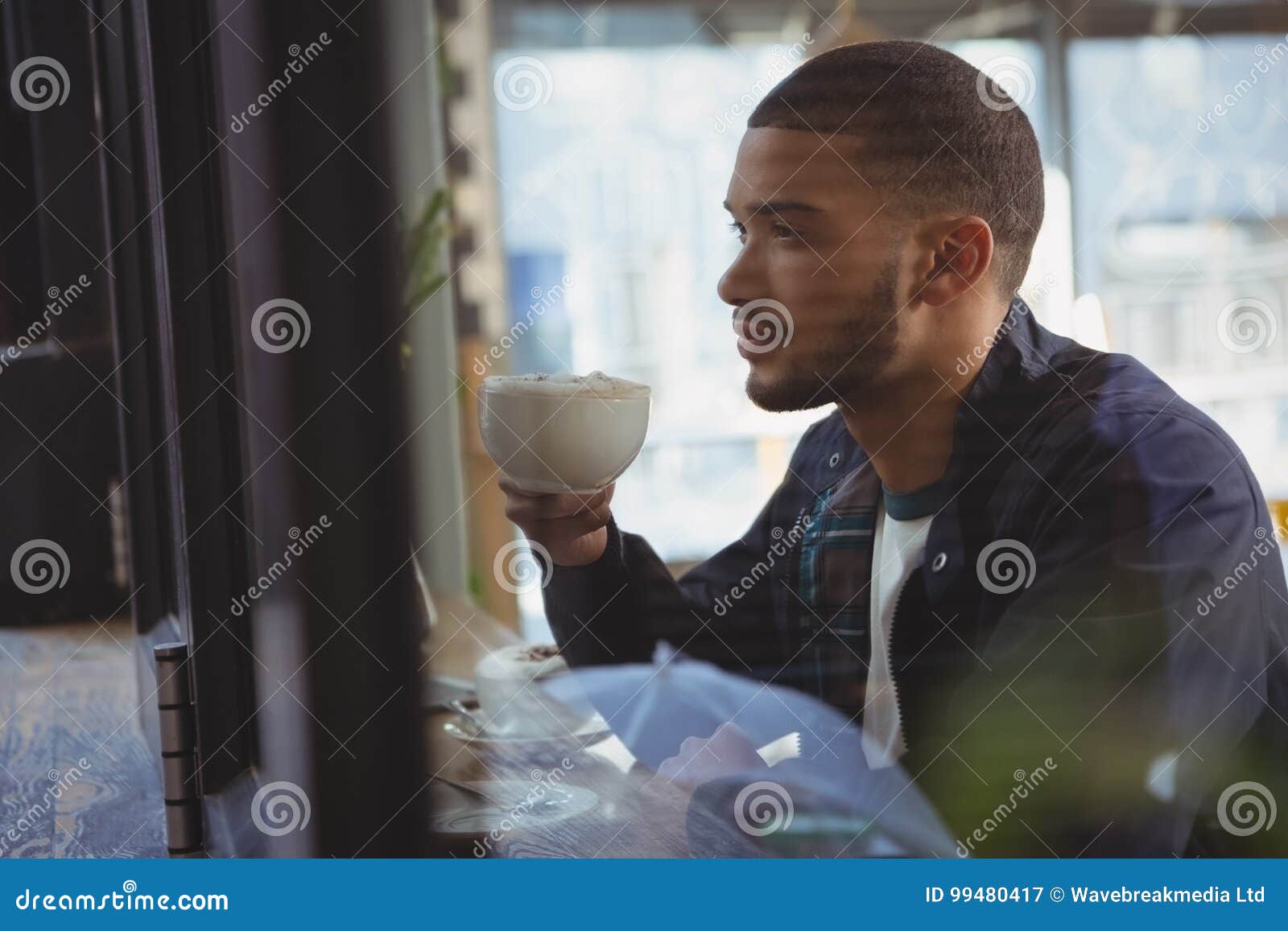 Thoughtful Young Man Having Coffee In Cafe Stock Image - Image of away ...

