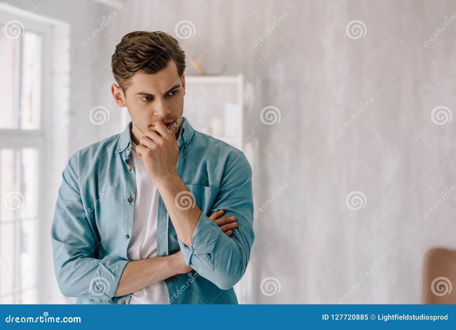 thoughtful young man wearing lounge wear clothes