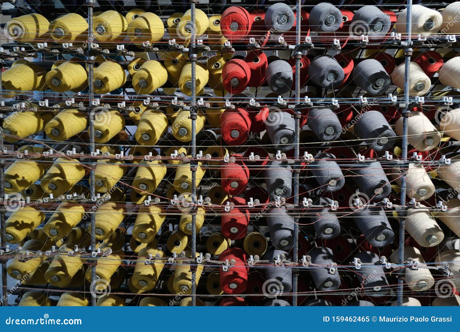 Thread Spools of an Industrial Weaving Loom for Fabrication of F Stock