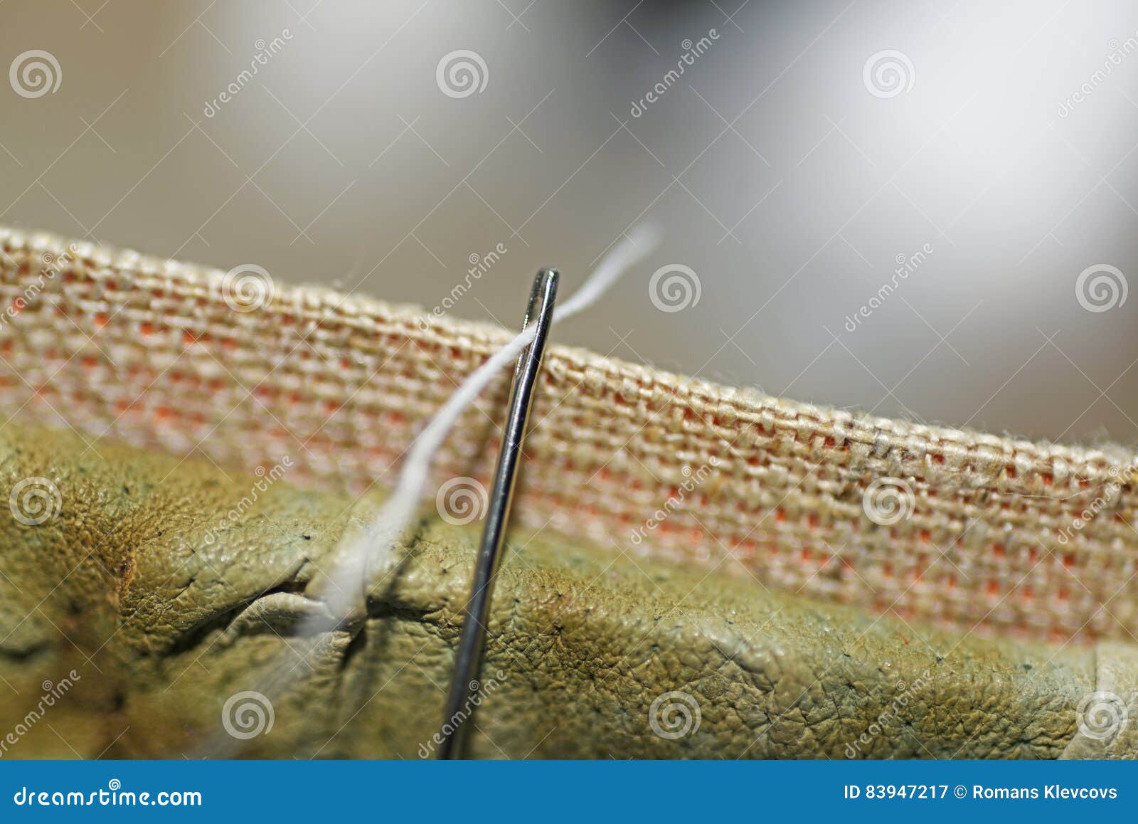 Threading a needle thread. stock image. Image of design - 83947217