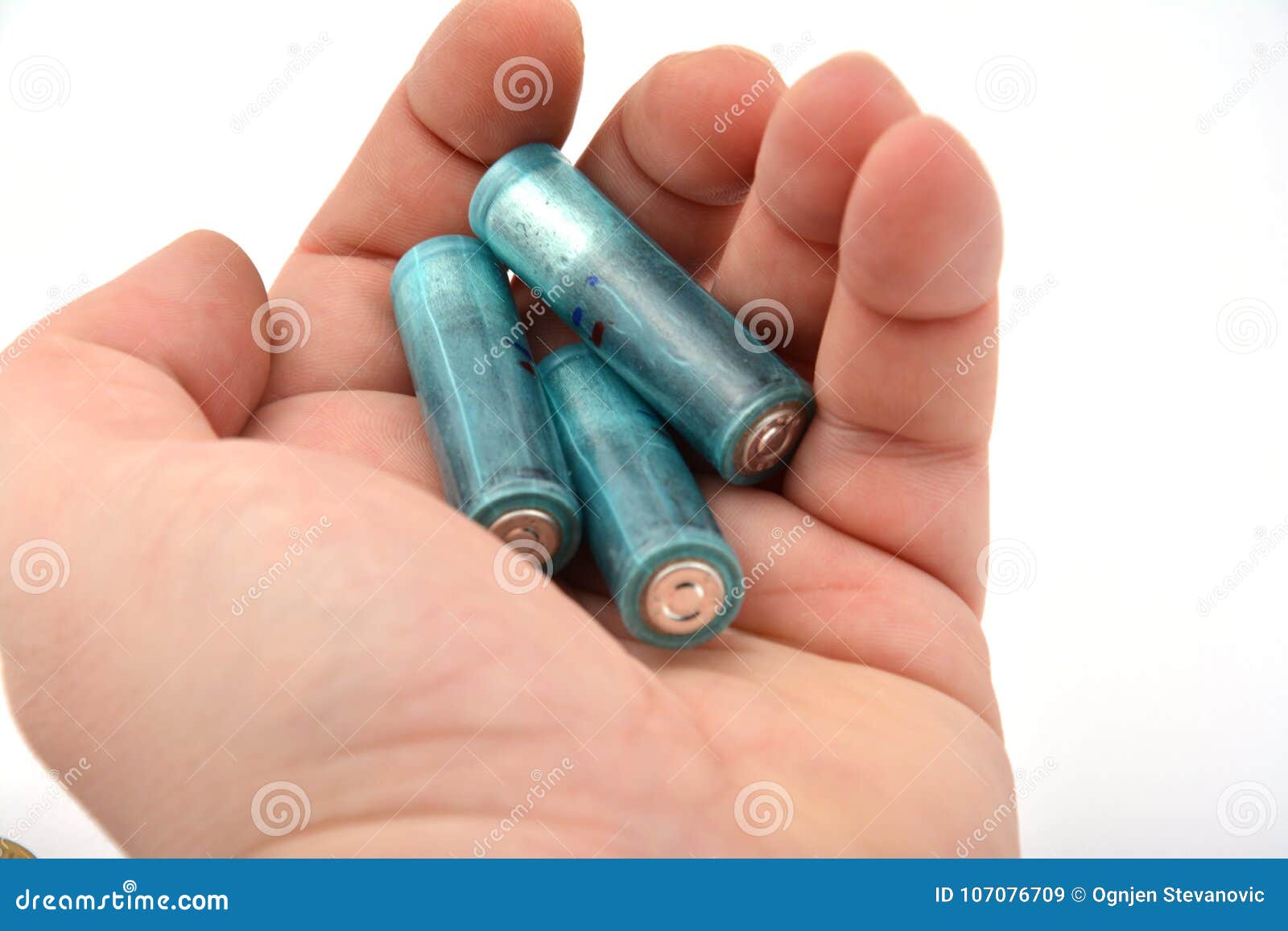 Three AAA Batteries in Hand Isolated on White Stock Image Image of equipment, background