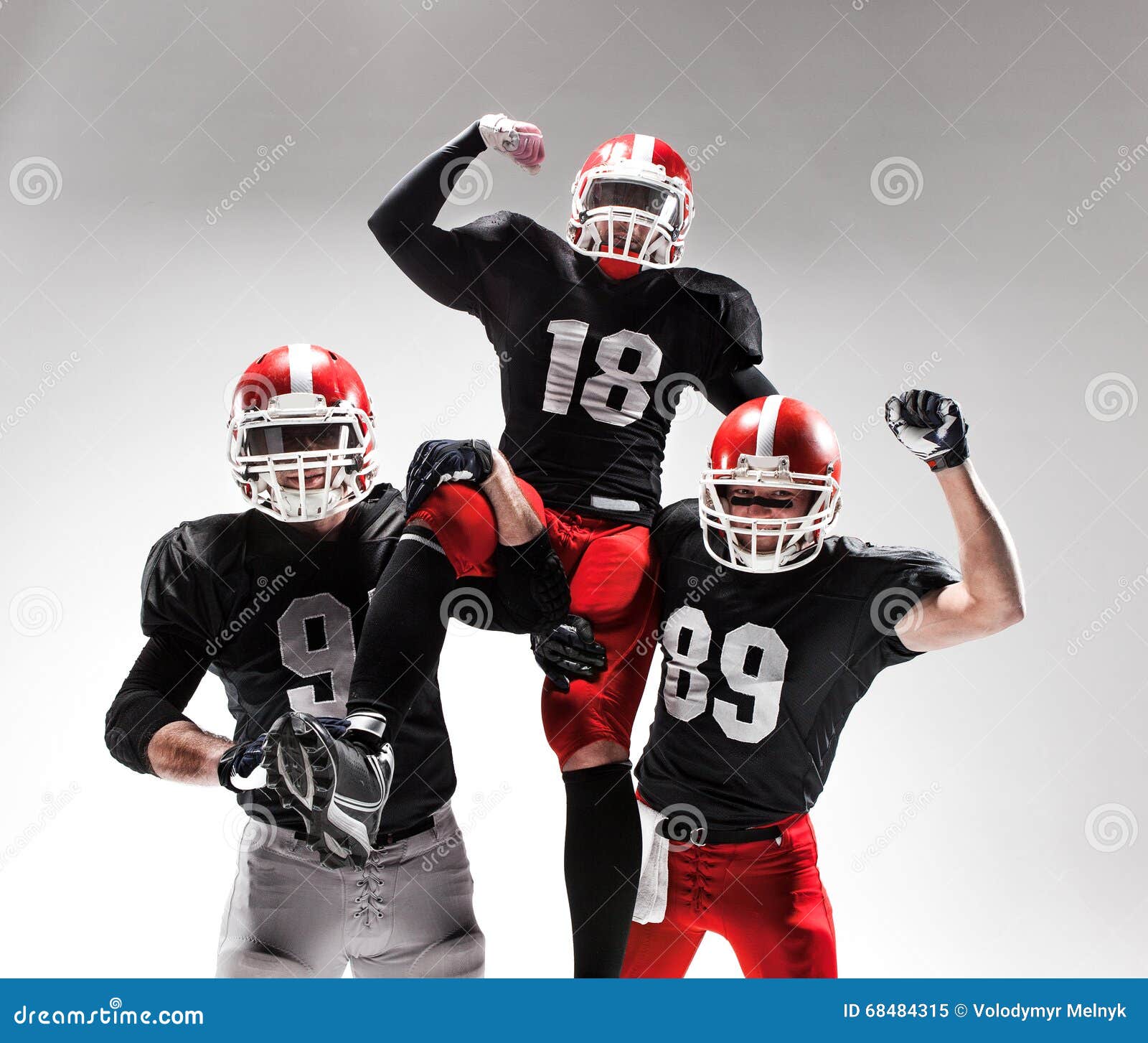 The Three American Football Players Posing On White