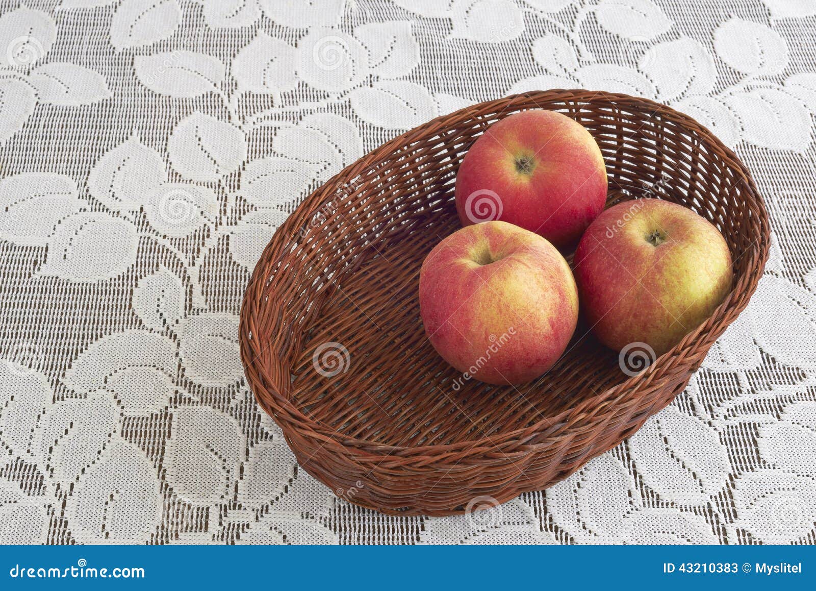 Three apples in a basket stock image. Image of brown 43210383