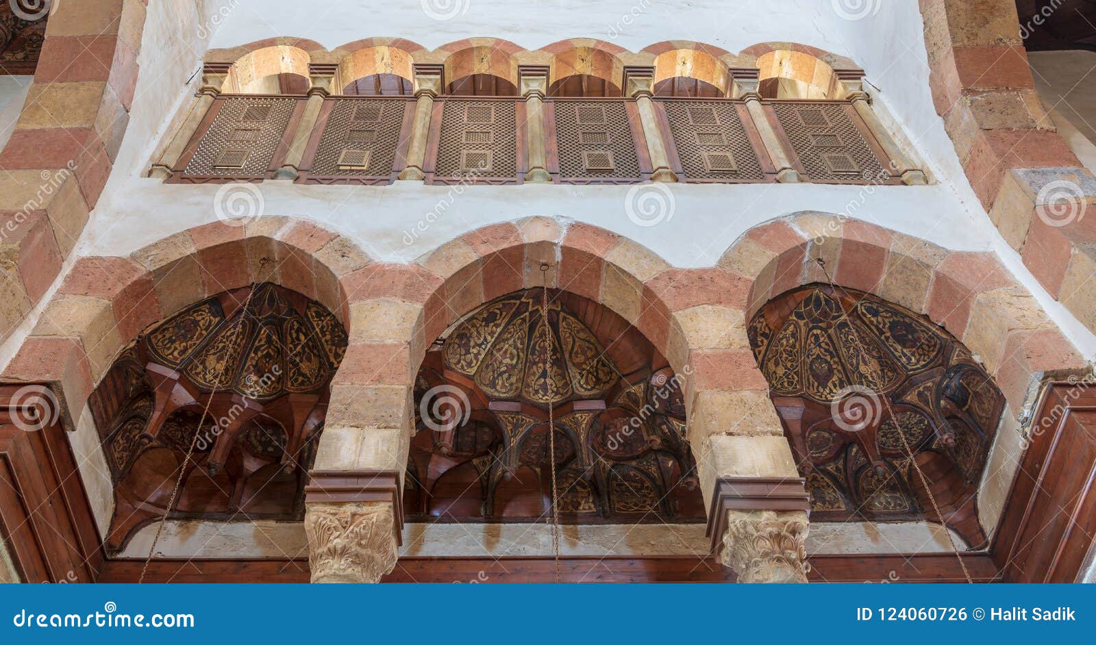 three arches revealing three wooden domes decorated with floral patterns with interleaved wood window mashrabiya, beshtak palace