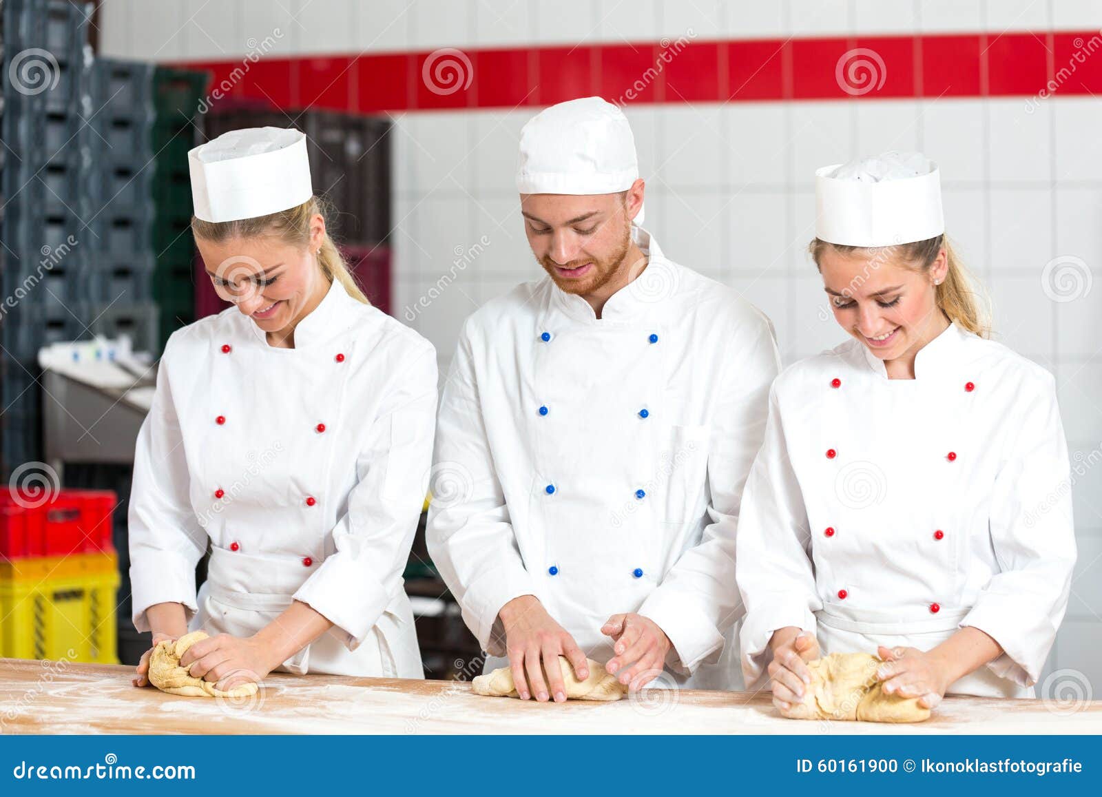 Three Bakers in Bakery Kneading Fresh Dough Stock Photo Image of