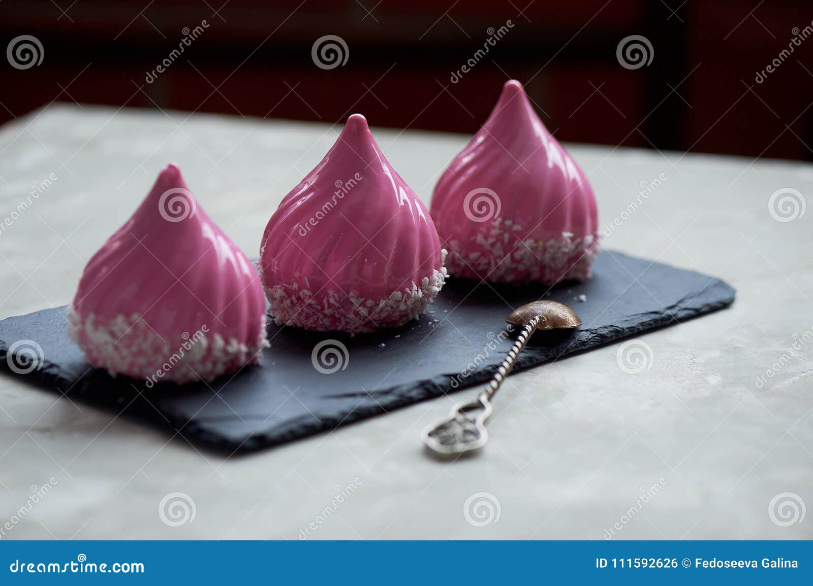 Three Beautiful Mousse Cakes Covered with Mirror Shiny Glaze.the Skill