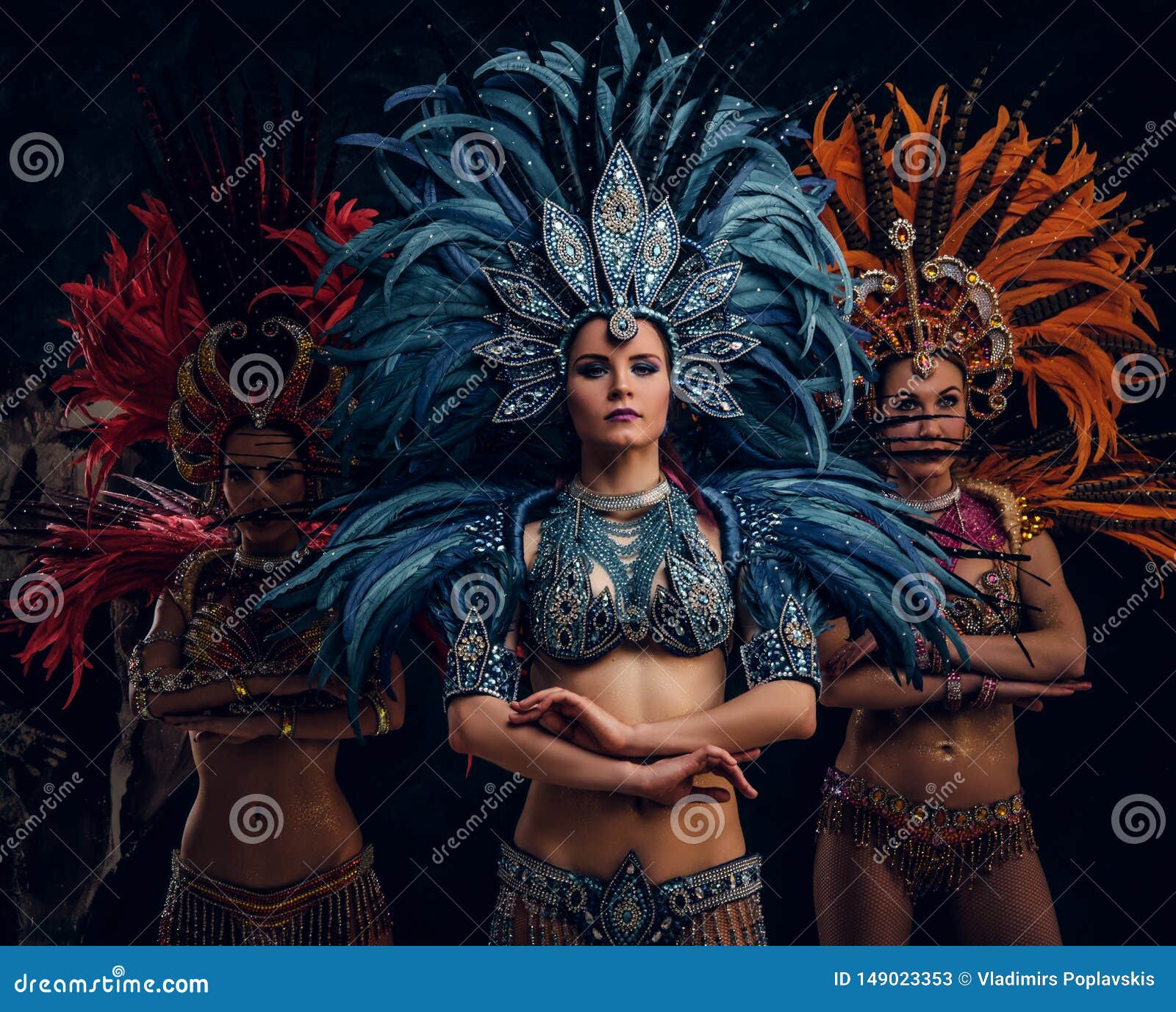 Three beautiful women in traditional brazilian carnival costumes