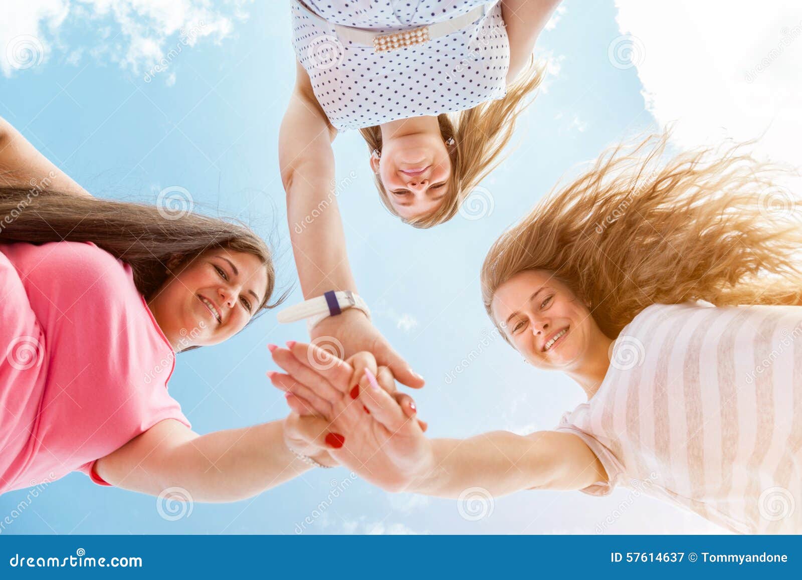 Three Best Friends Looking Down and Holding Hands Stock Image ...