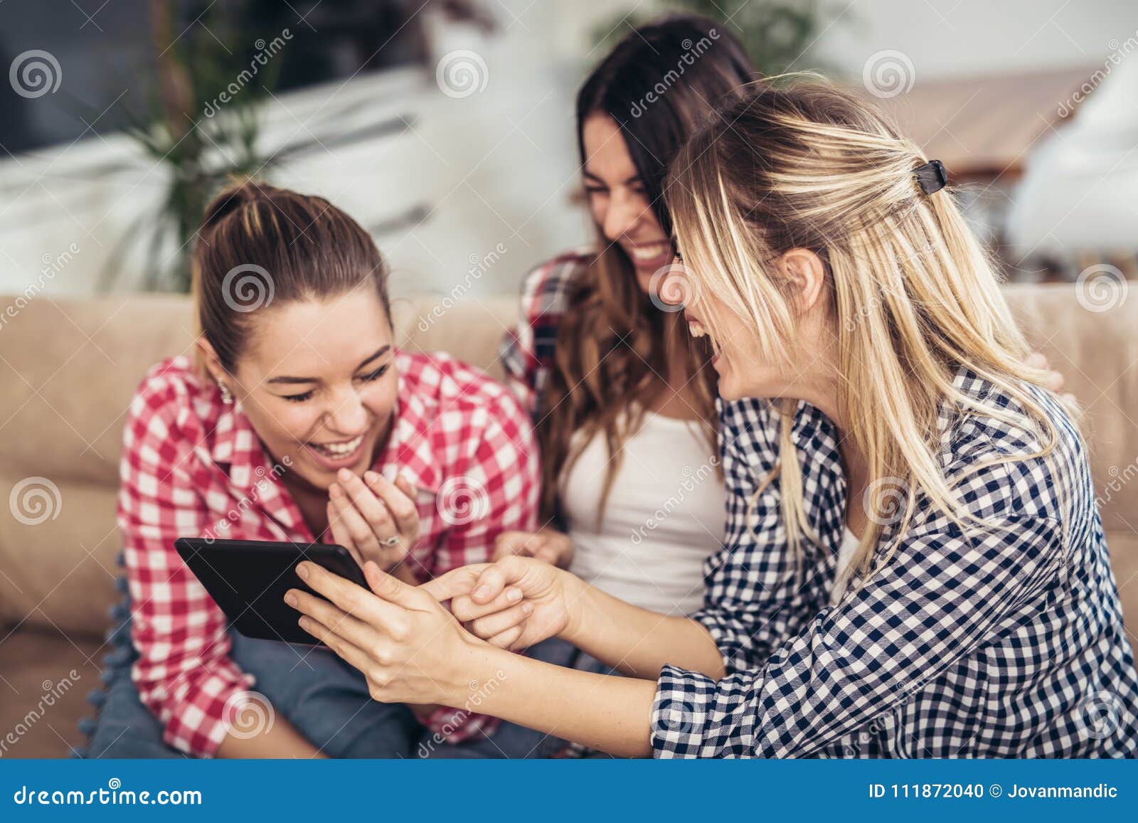 Three Best Friends Using Digital Tablet Together. Stock Photo - Image ...