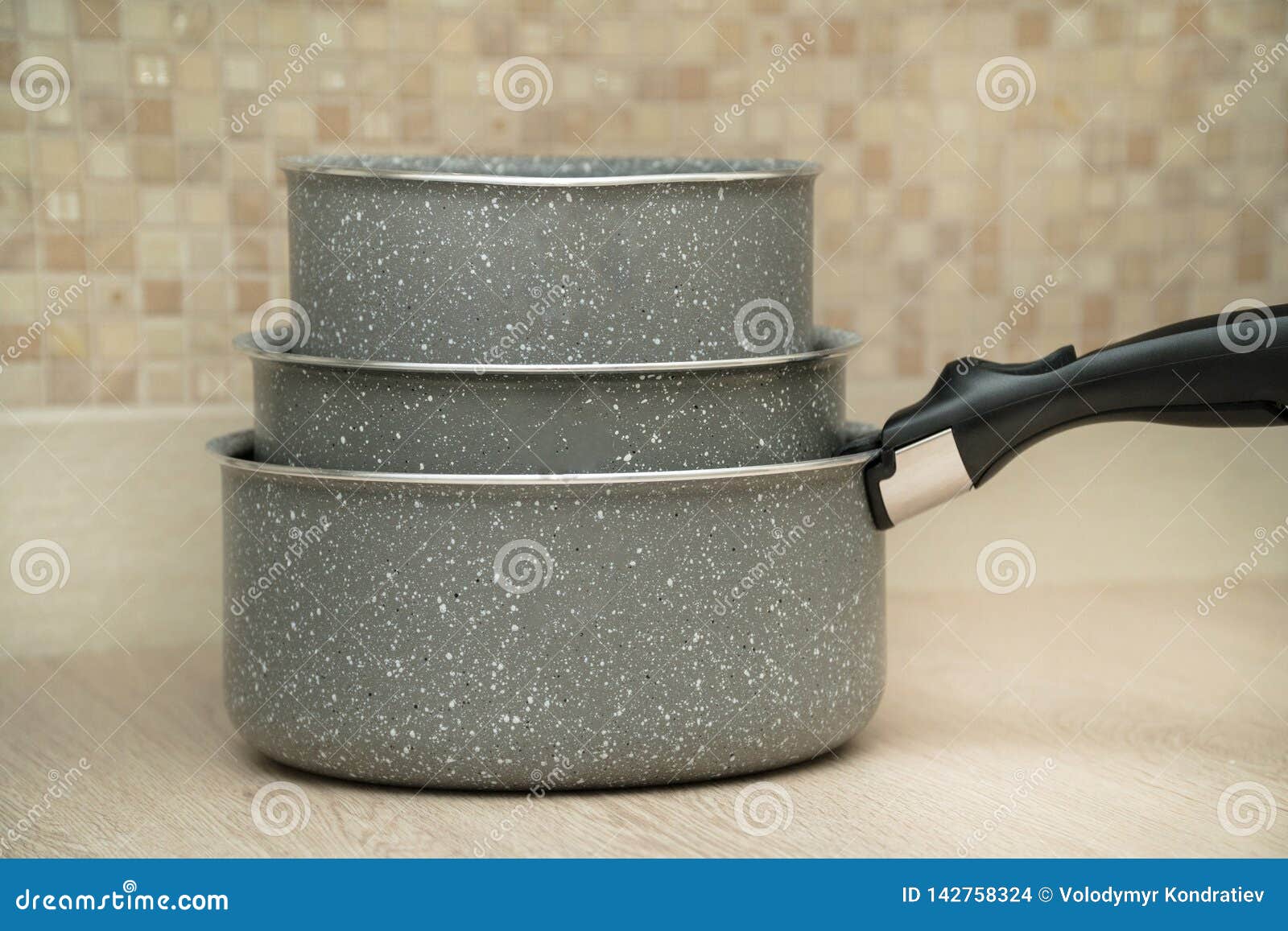 Three Big Pot in Modern Kitchen on a Wooden Table Stock Photo Image