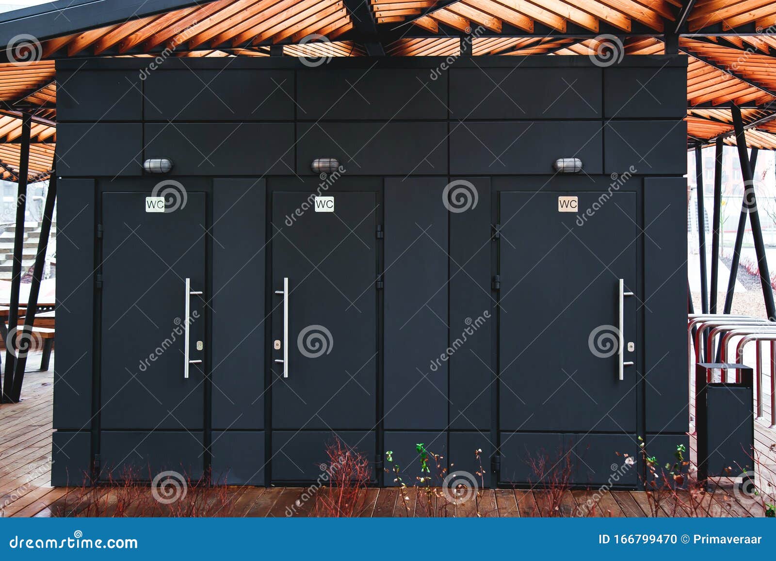 Three Black Public Toilet Doors on the Street 1 Stock Photo Image of