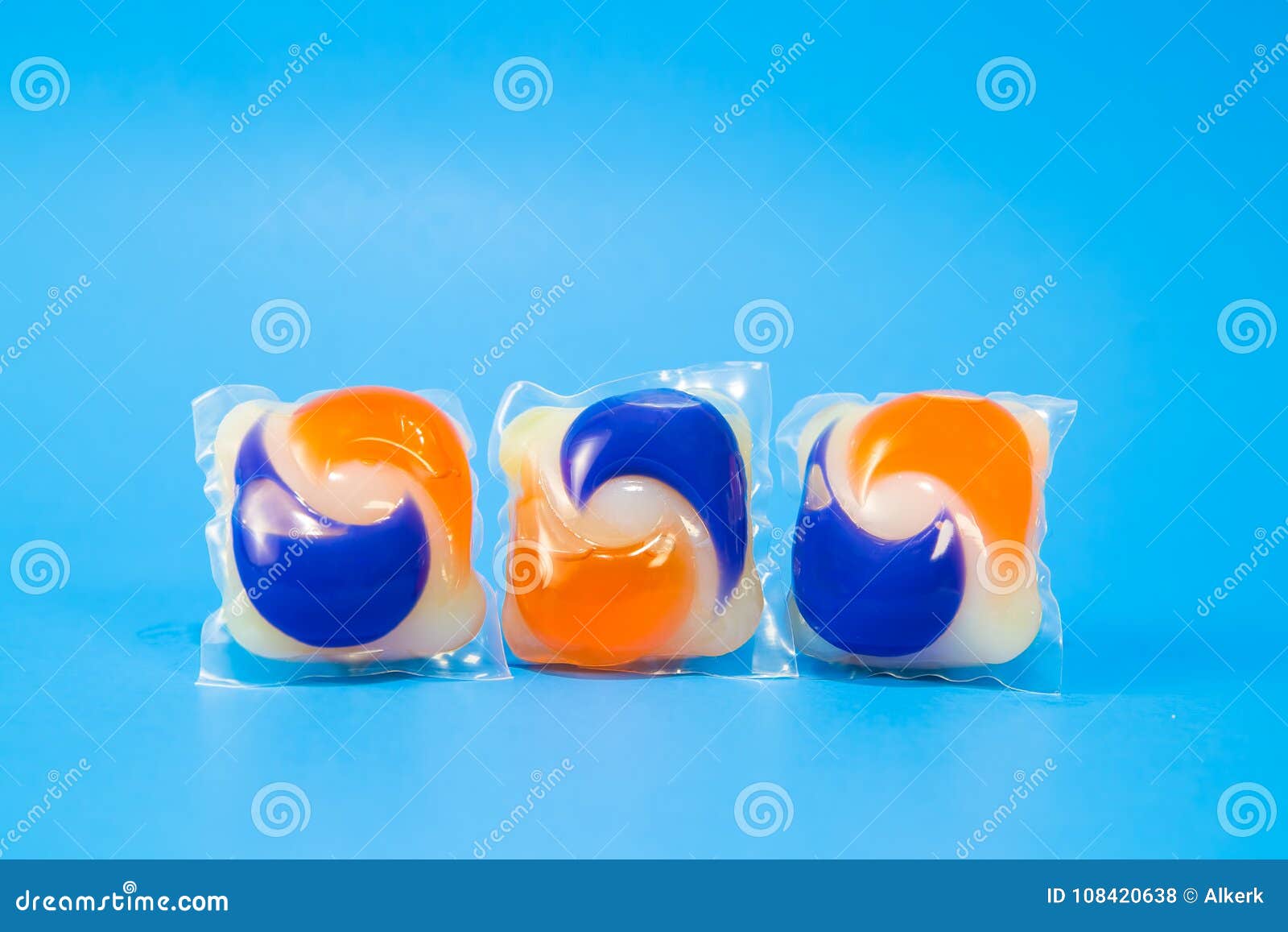 laundry detergent pods capsules on a blue background