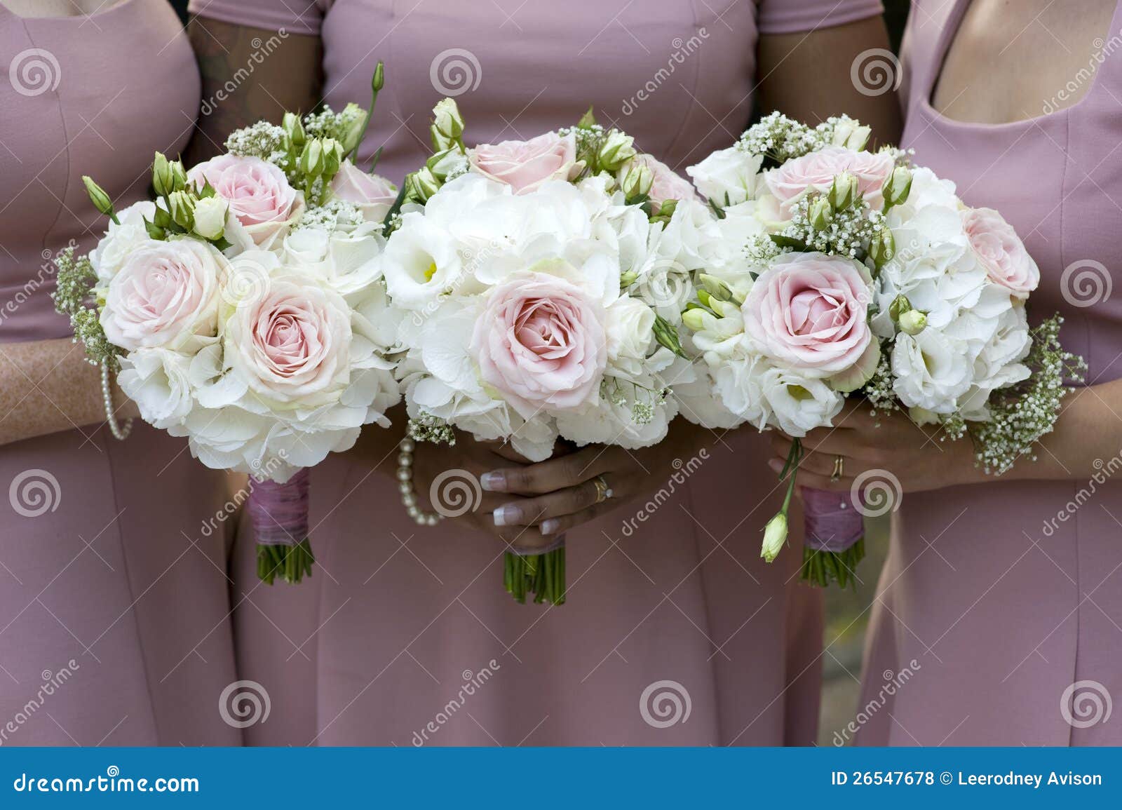 Three Bridesmaids Holding Wedding Bouquet Stock Photo - Image of ...