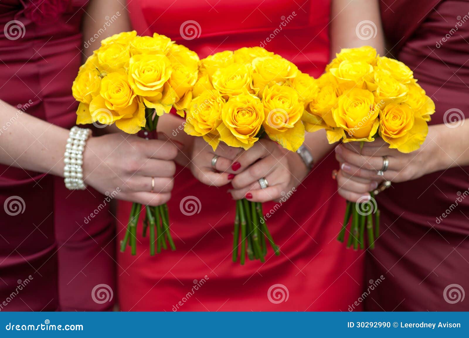 three bridesmaids holding wedding bouquets yellow roses 30292990