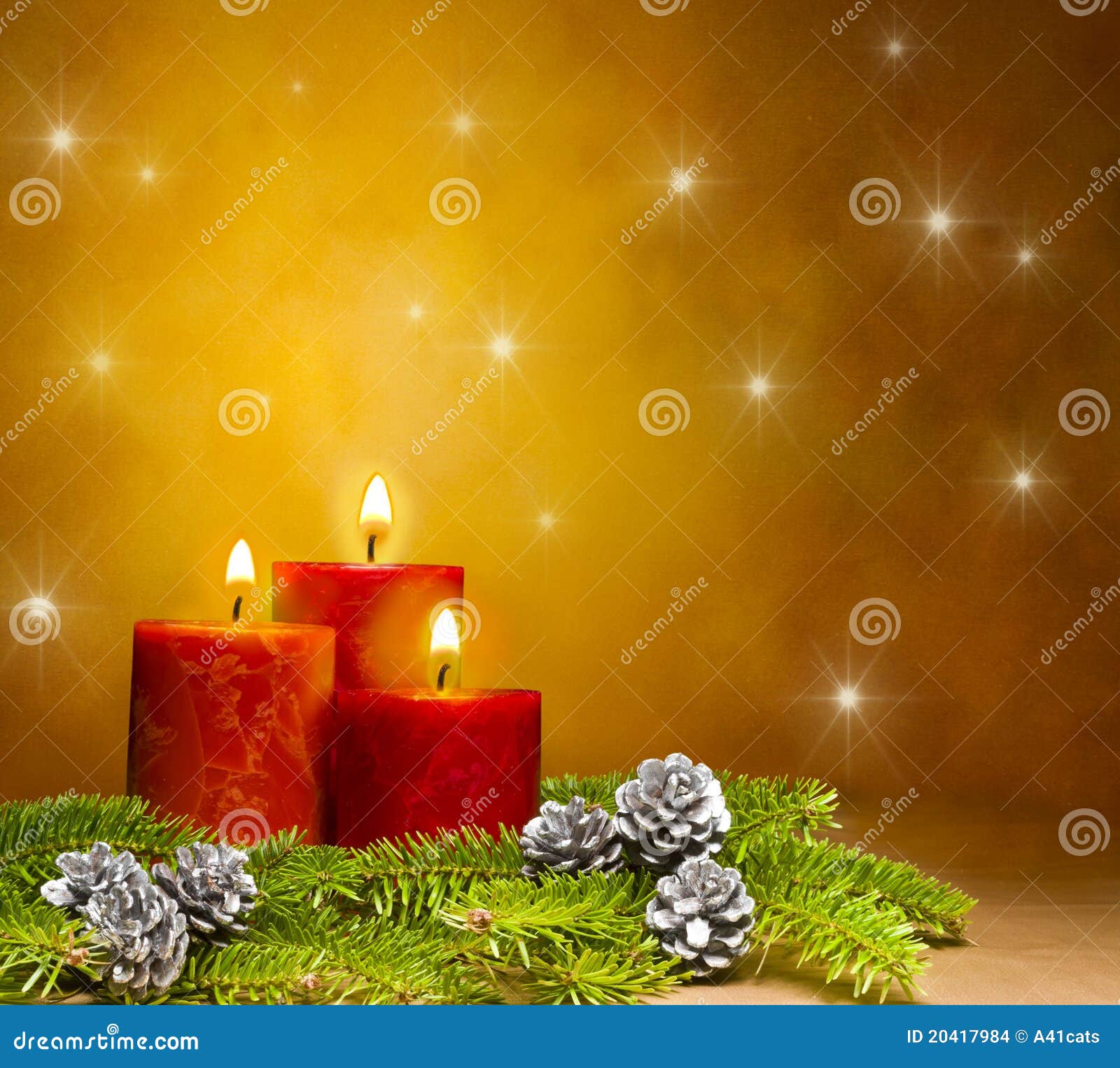 three candles in a festive christmas setting