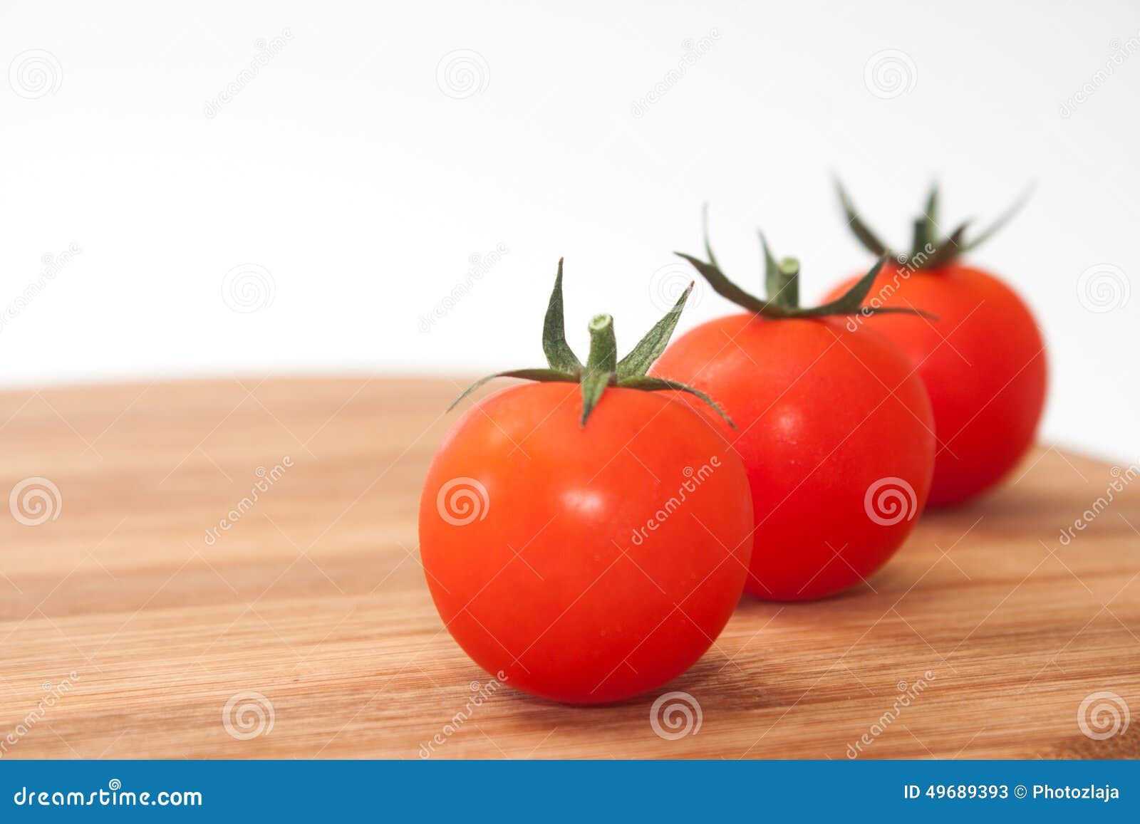 Three Cherry Tomatoes on the Kitchen Wooden Board Stock Image Image