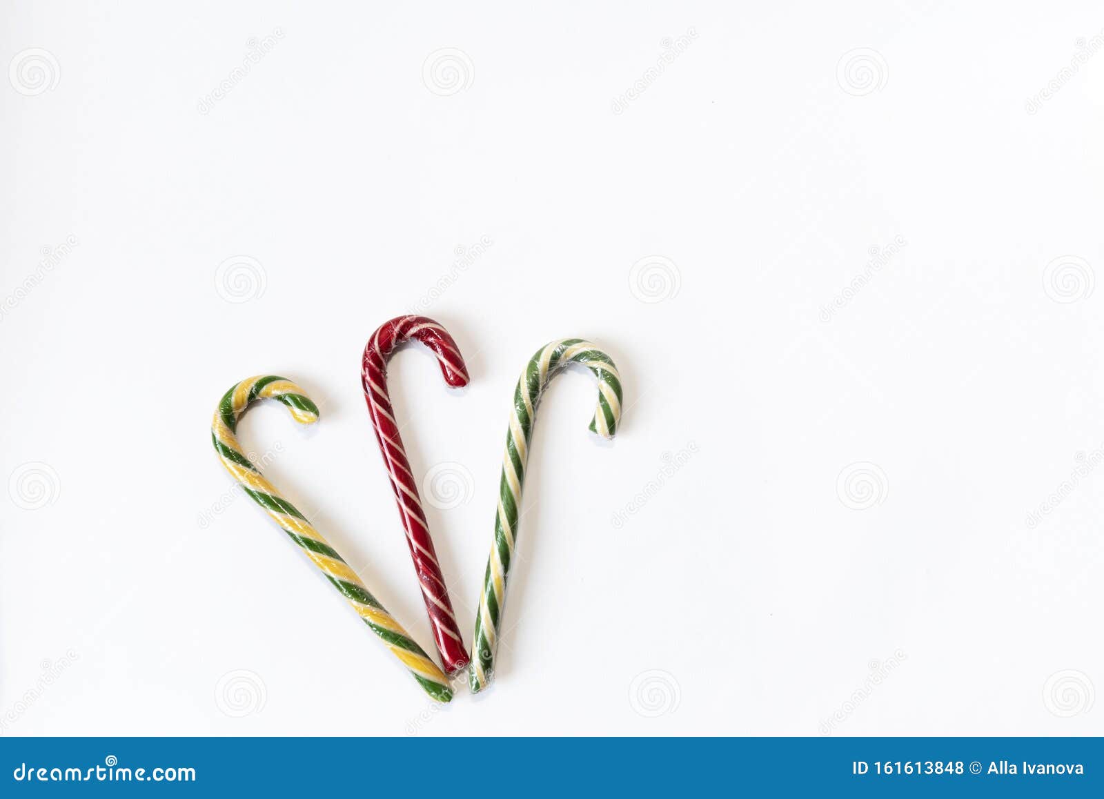 Three Christmas Decorative Candy Canes Isolated on White Background. Copy Space Stock Photo