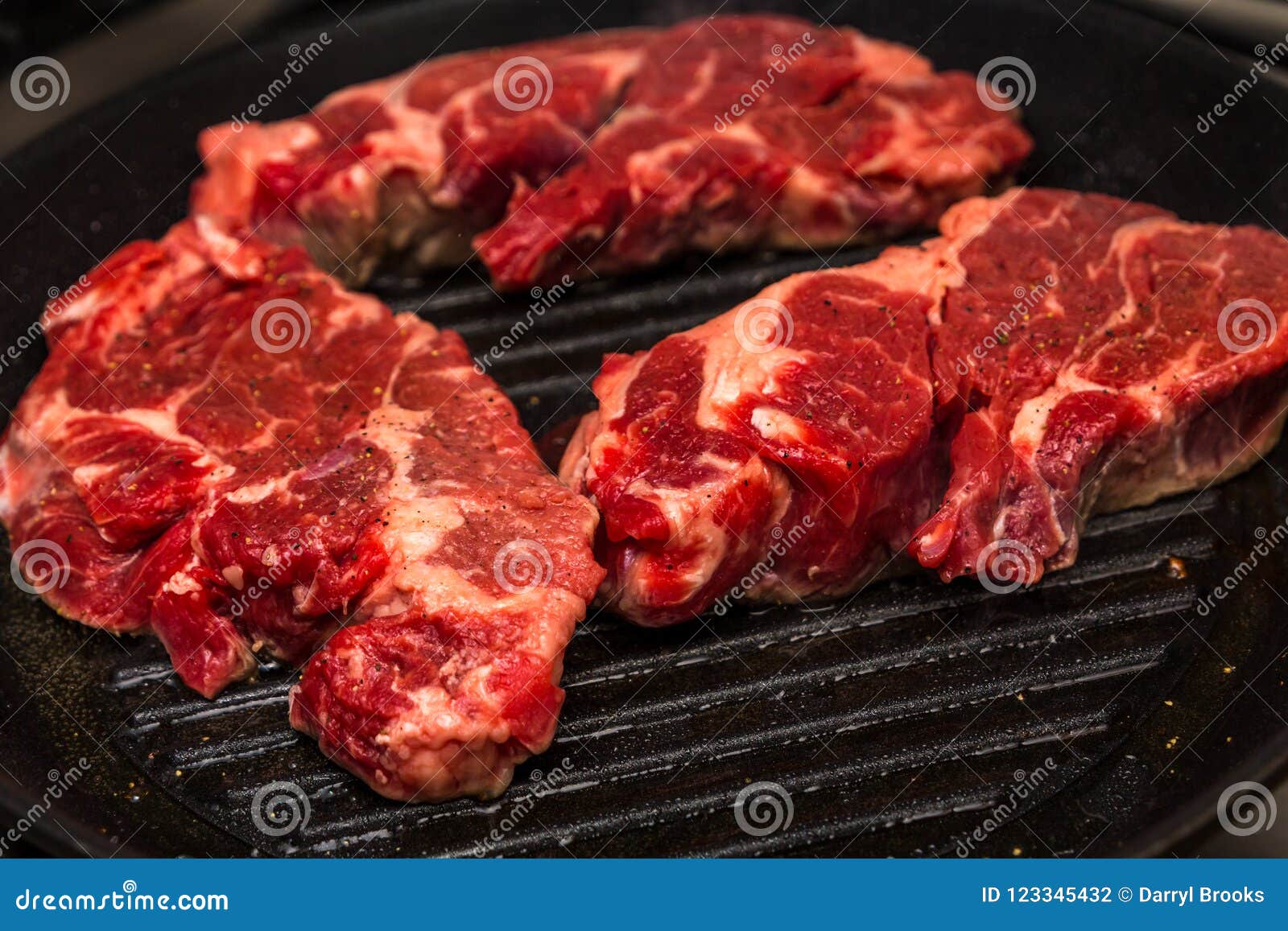 Three Chuck Steaks on Skillet Stock Photo Image of loin, cast 123345432