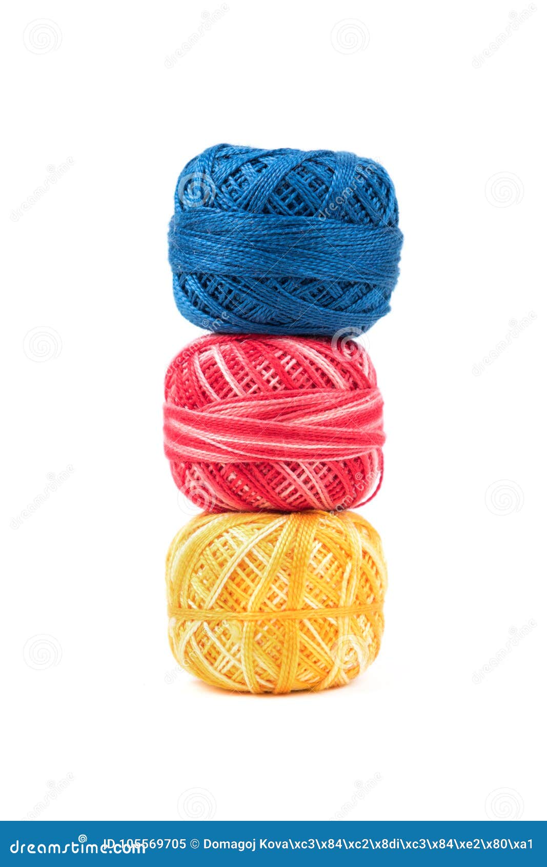 Three Colored Sewing Threads in a Row on a White Vertical Background