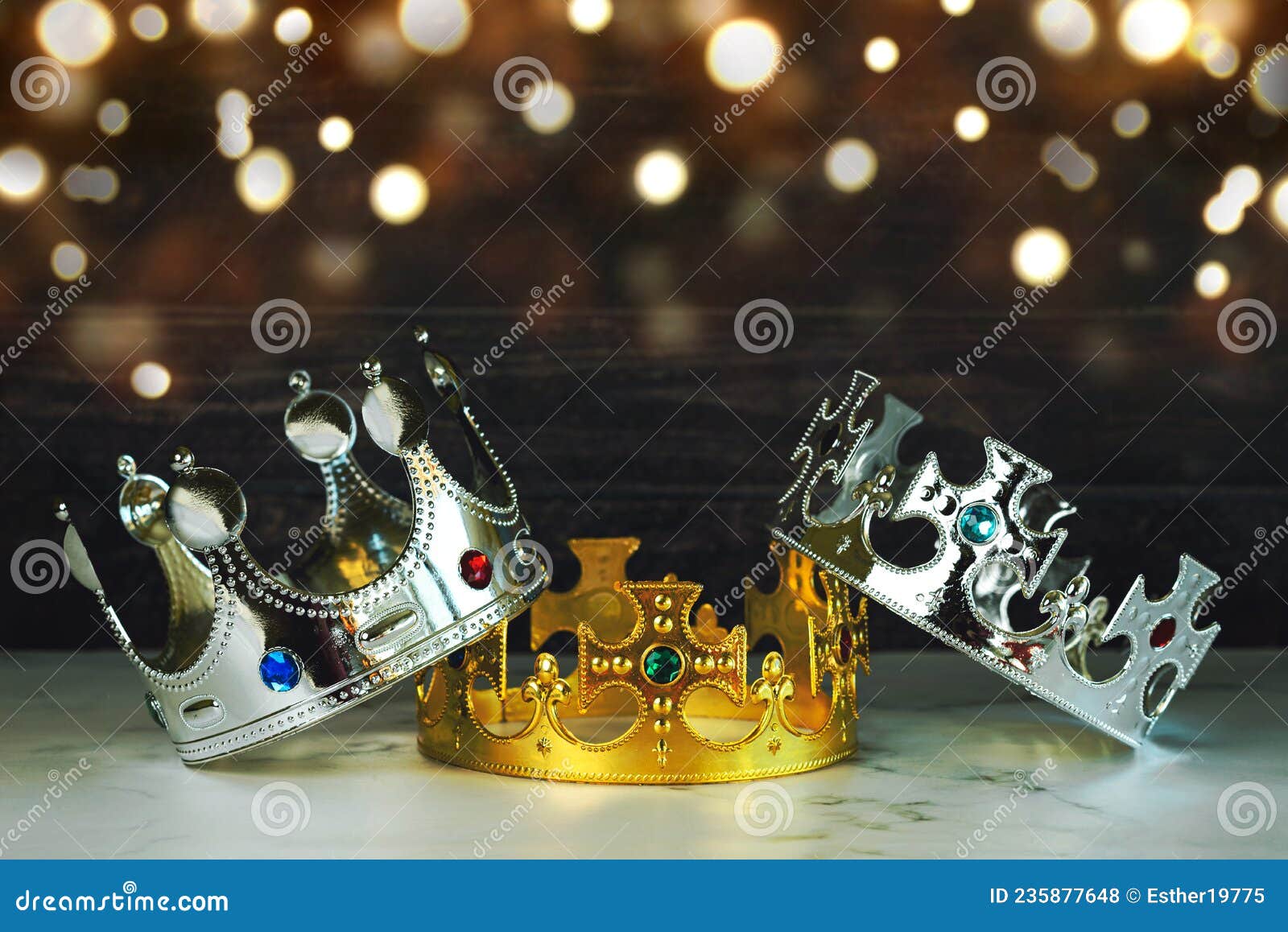 three crowns of the three wise men with christmas lights. concept for dia de reyes magos day. three wise men