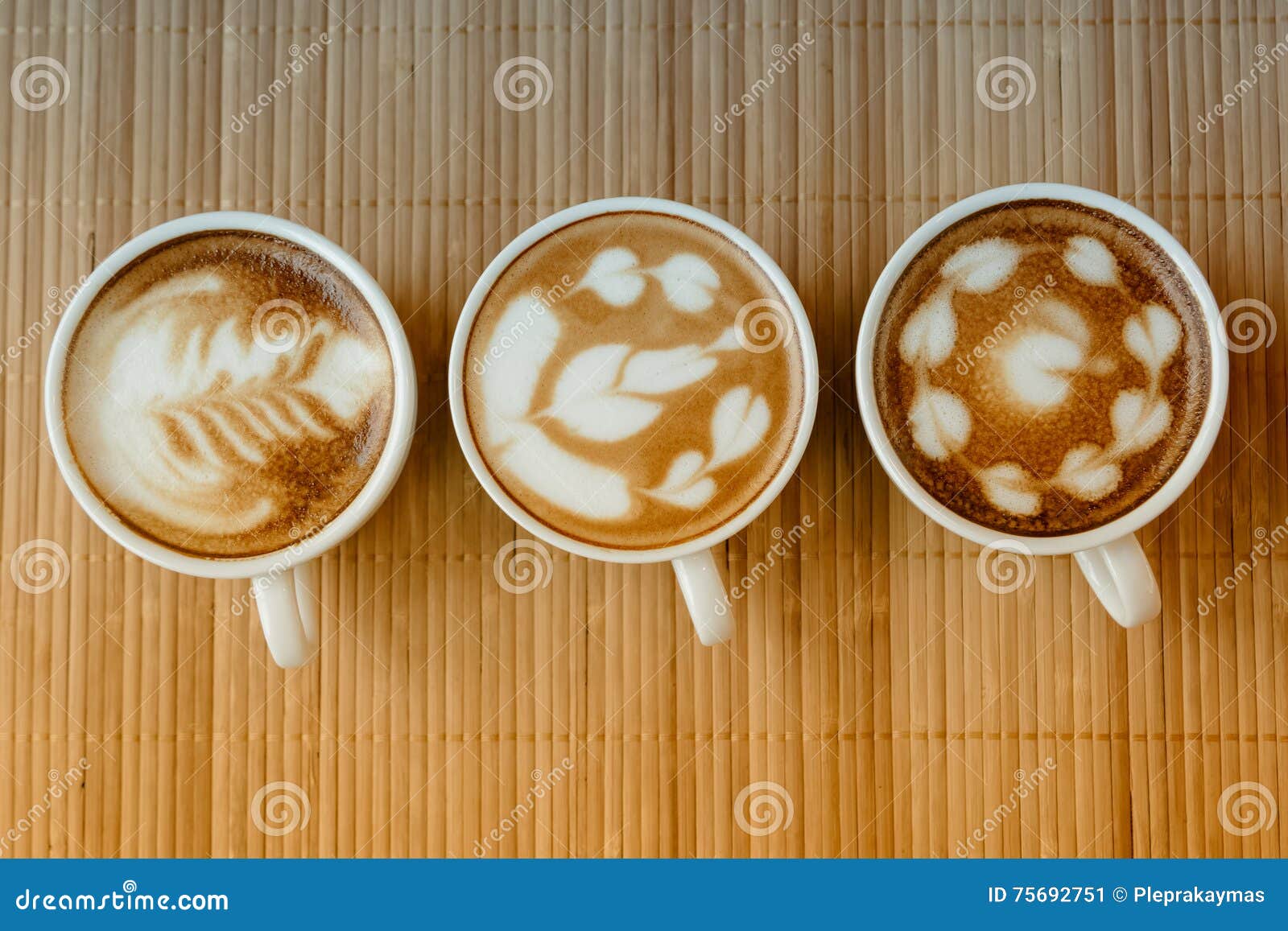 Three Cups of Cafe Latte with Three Shapes of Latte Art Stock Image