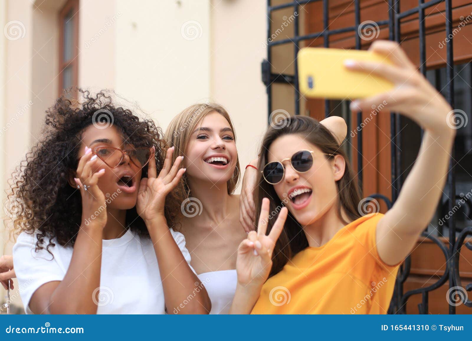 Three Cute Young Girls Friends Having Fun Together, Taking a Selfie at ...