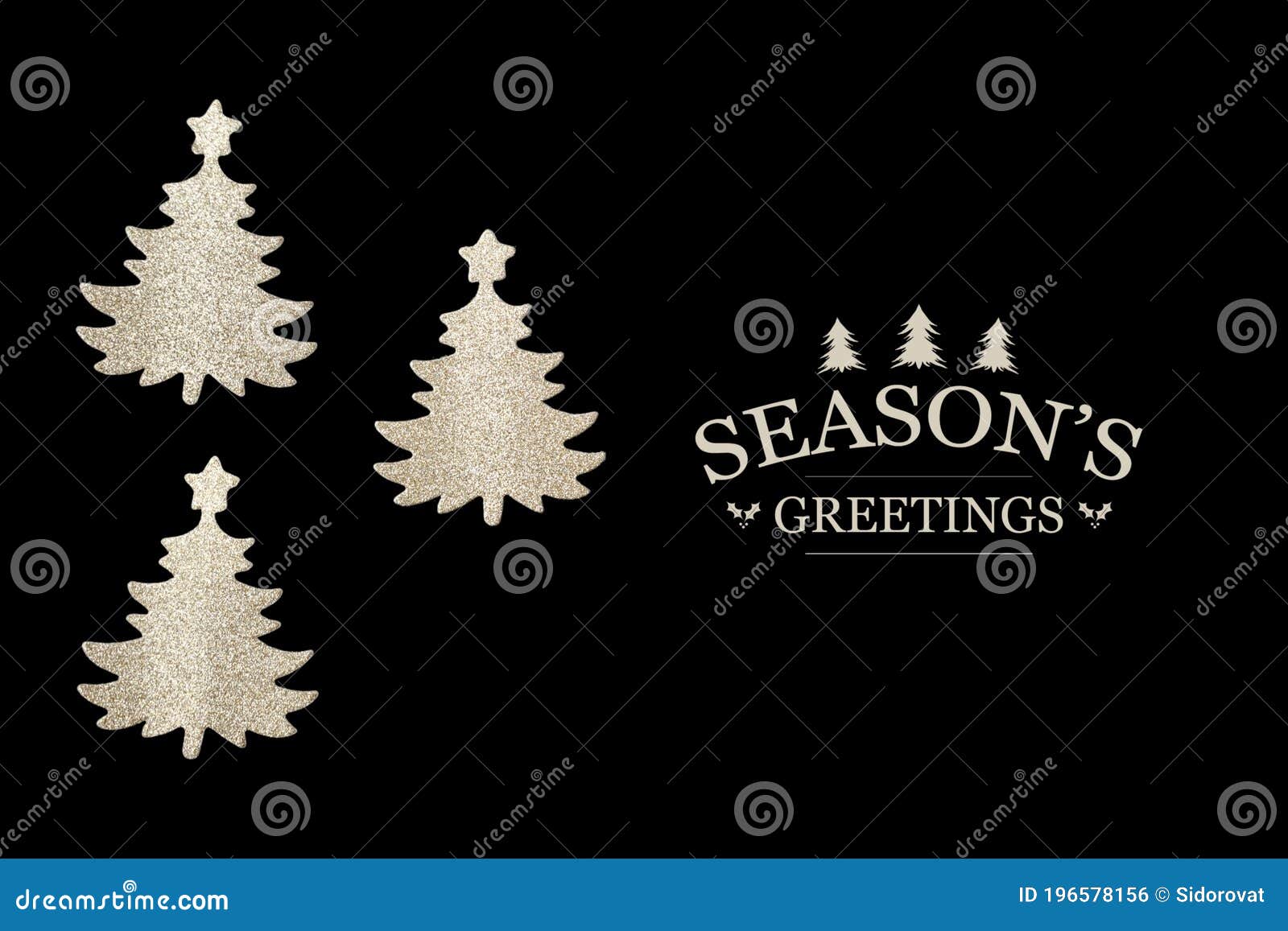 three cutout christmas trees on black background with seasons`s greetings text