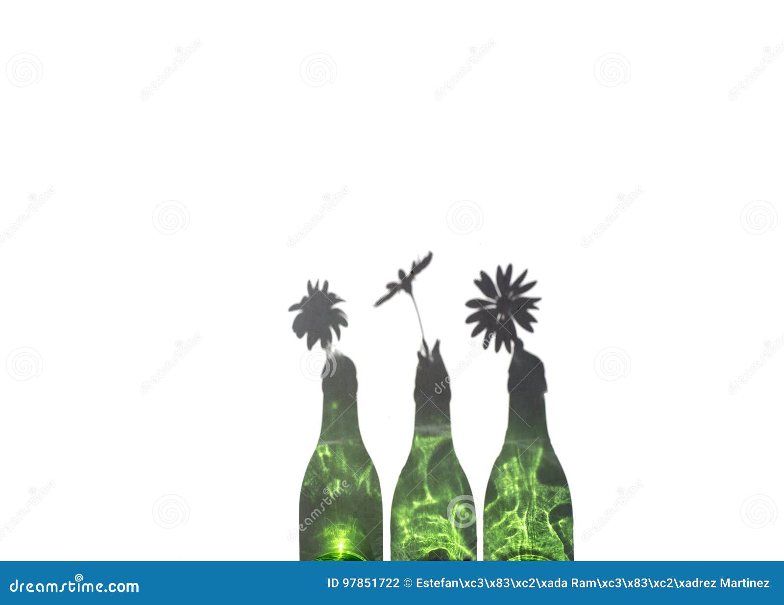three daisies in green bottle