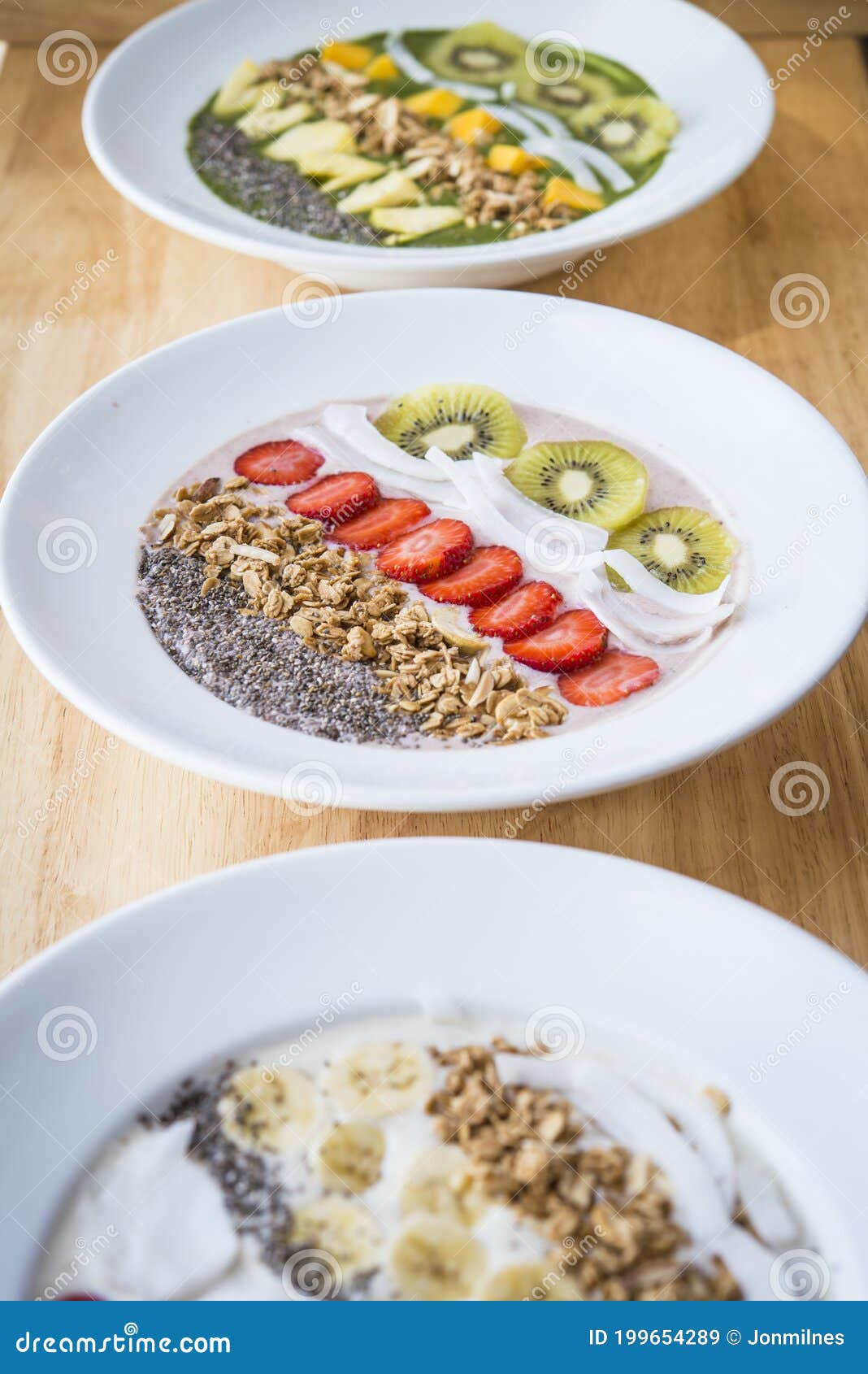 Three Different Smoothie Bowl with a Selection of Fruit Granola, Chia