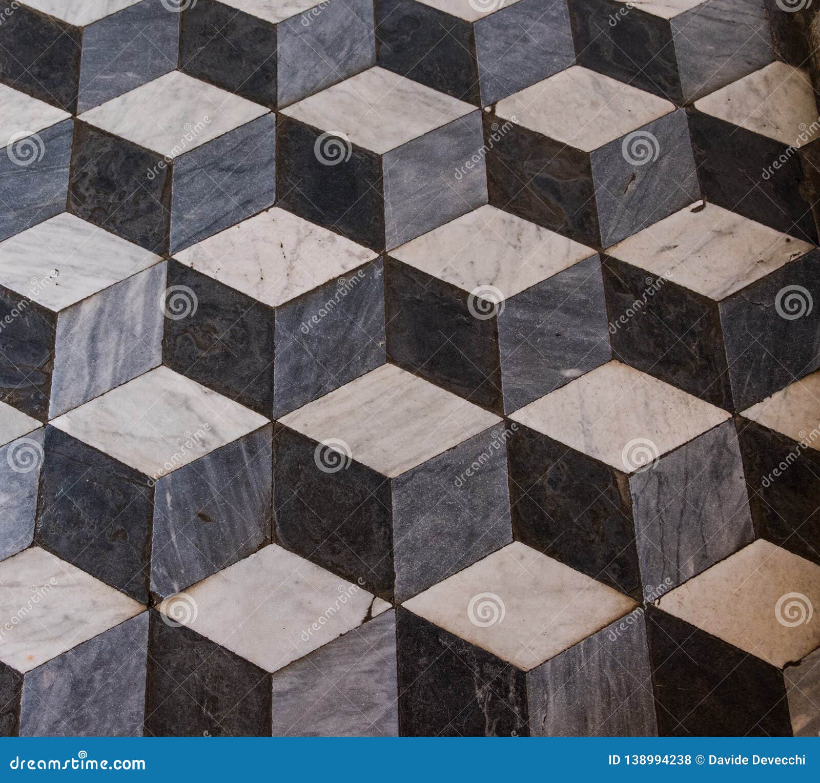 the three-dimensional effect f a marble cube floor in a church