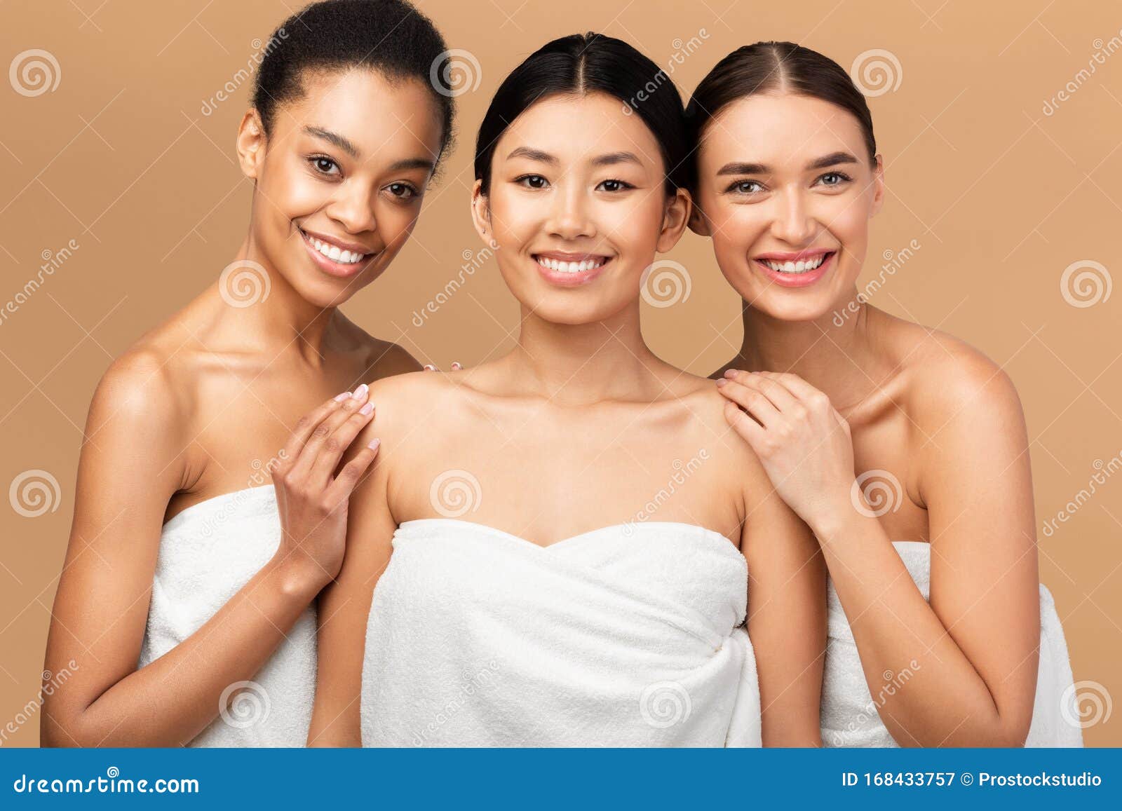 Glad millennial diverse women in underwear with different body types enjoy  beauty care Stock Photo by Prostock-studio