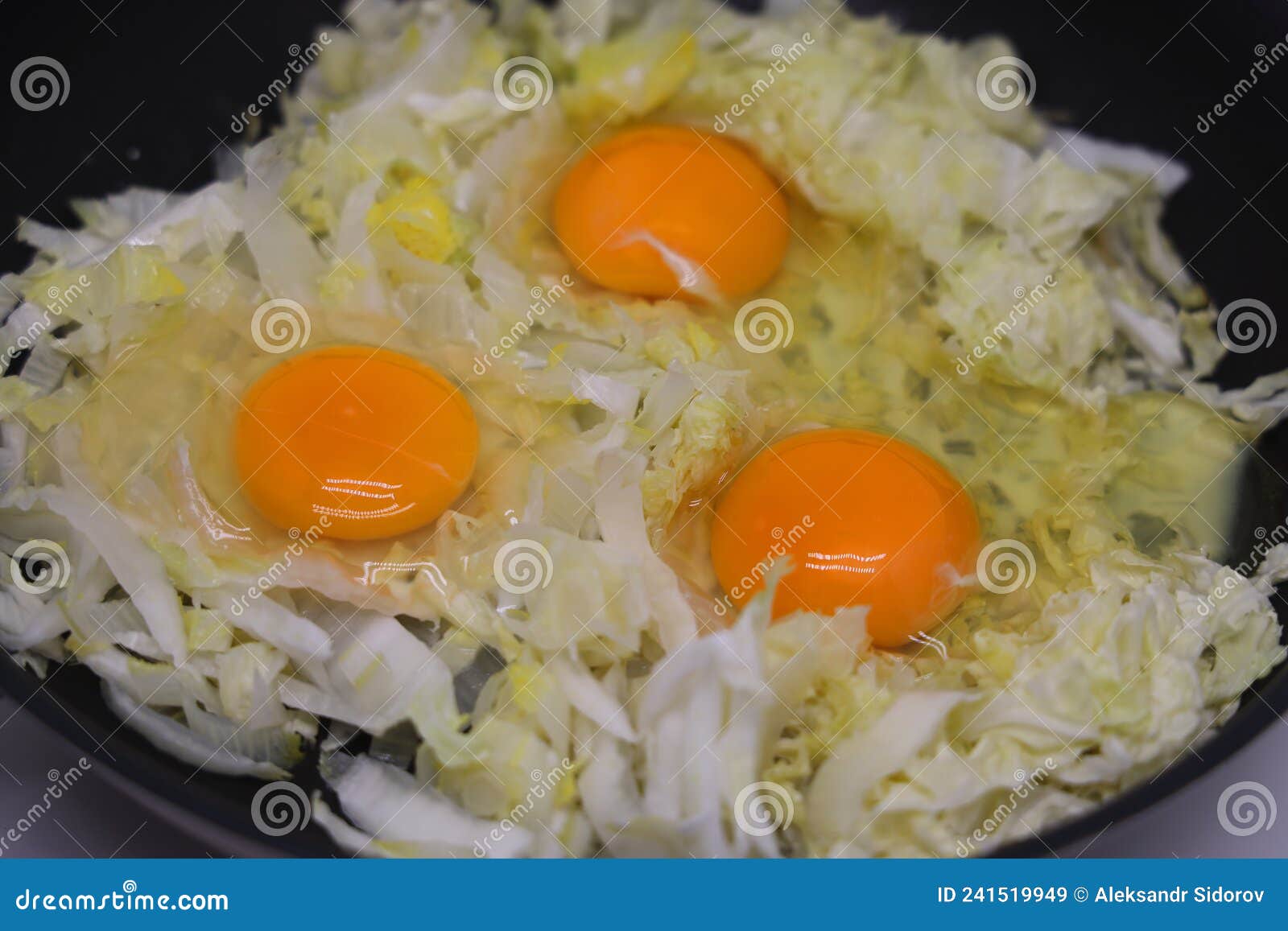 Three Egg Scrambled Eggs with Stewed Cabbage in a Black Pan, Diet