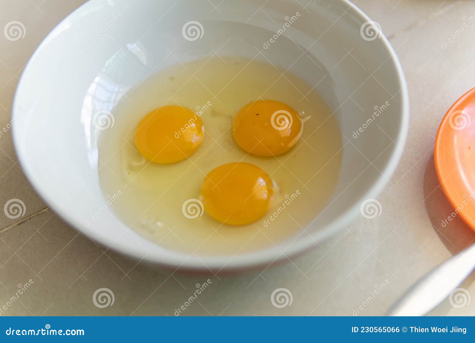 Three egg on a white bowl stock photo. Image of nutritious 230565066